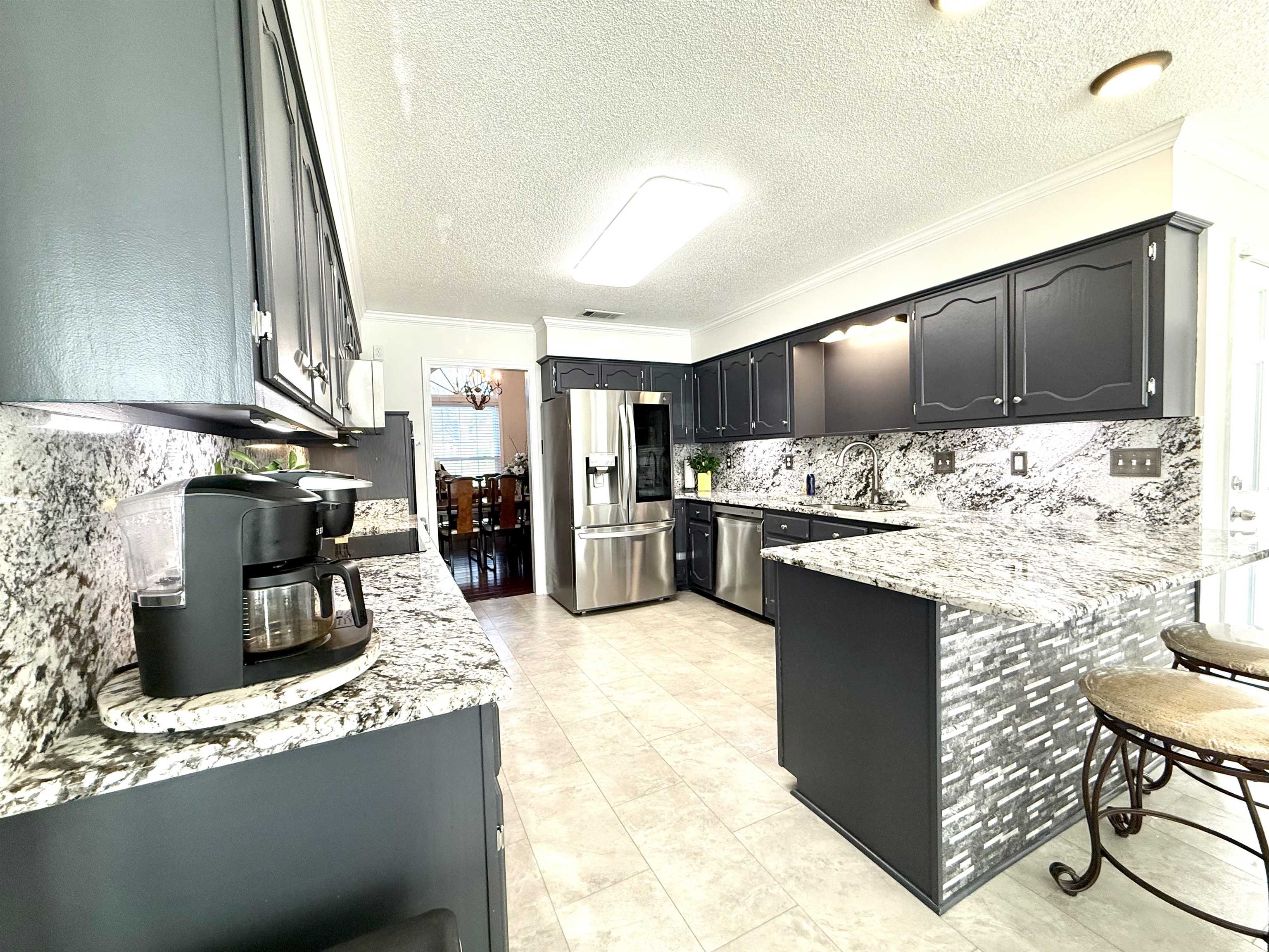 825 North Walnut Bend Road Memphis, TN 38018 - Photo 12 of 40 a kitchen with refrigerator and cabinets