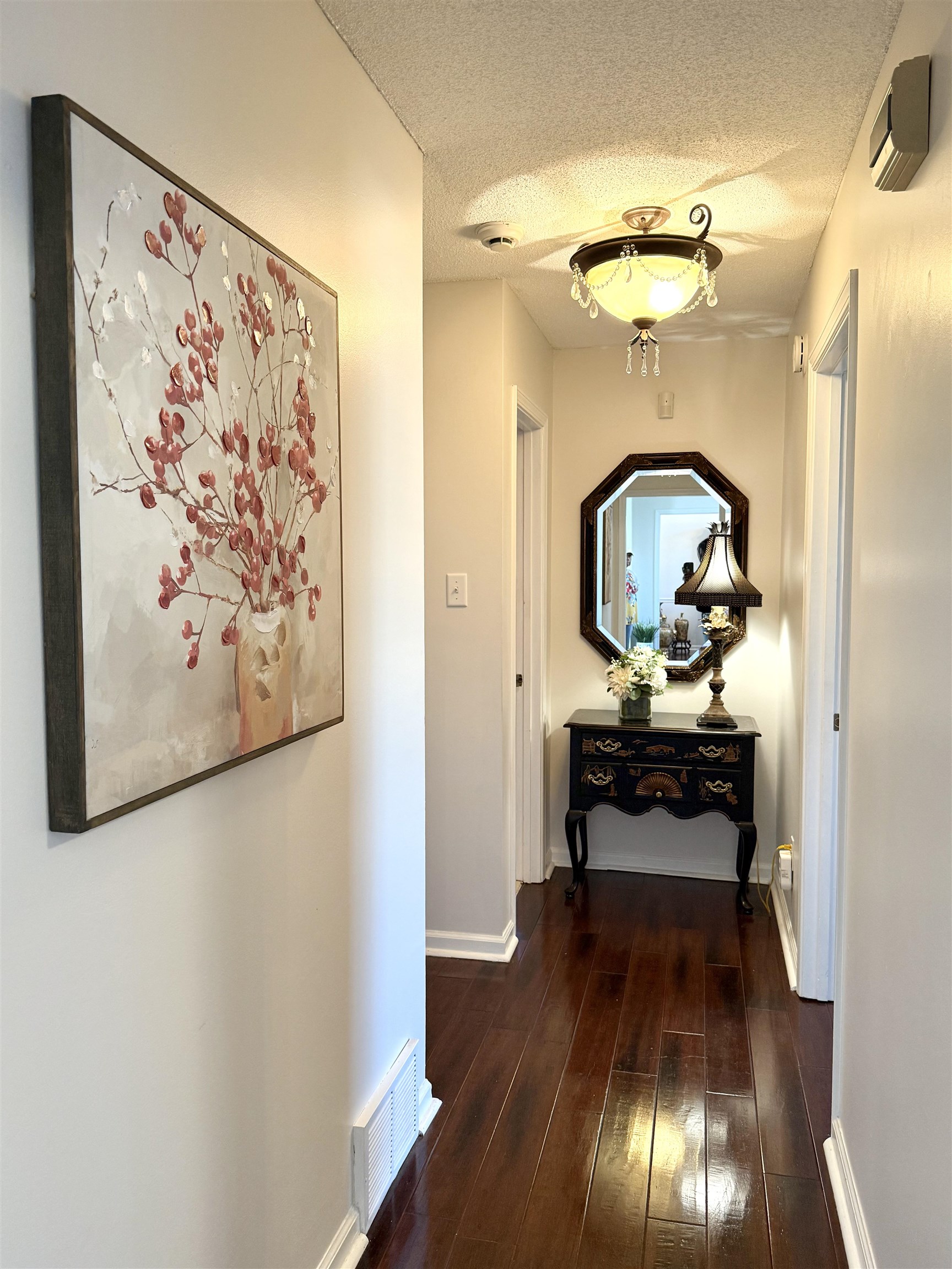 825 North Walnut Bend Road Memphis, TN 38018 - Photo 17 of 40 a view of a hallway with wooden floor and furniture