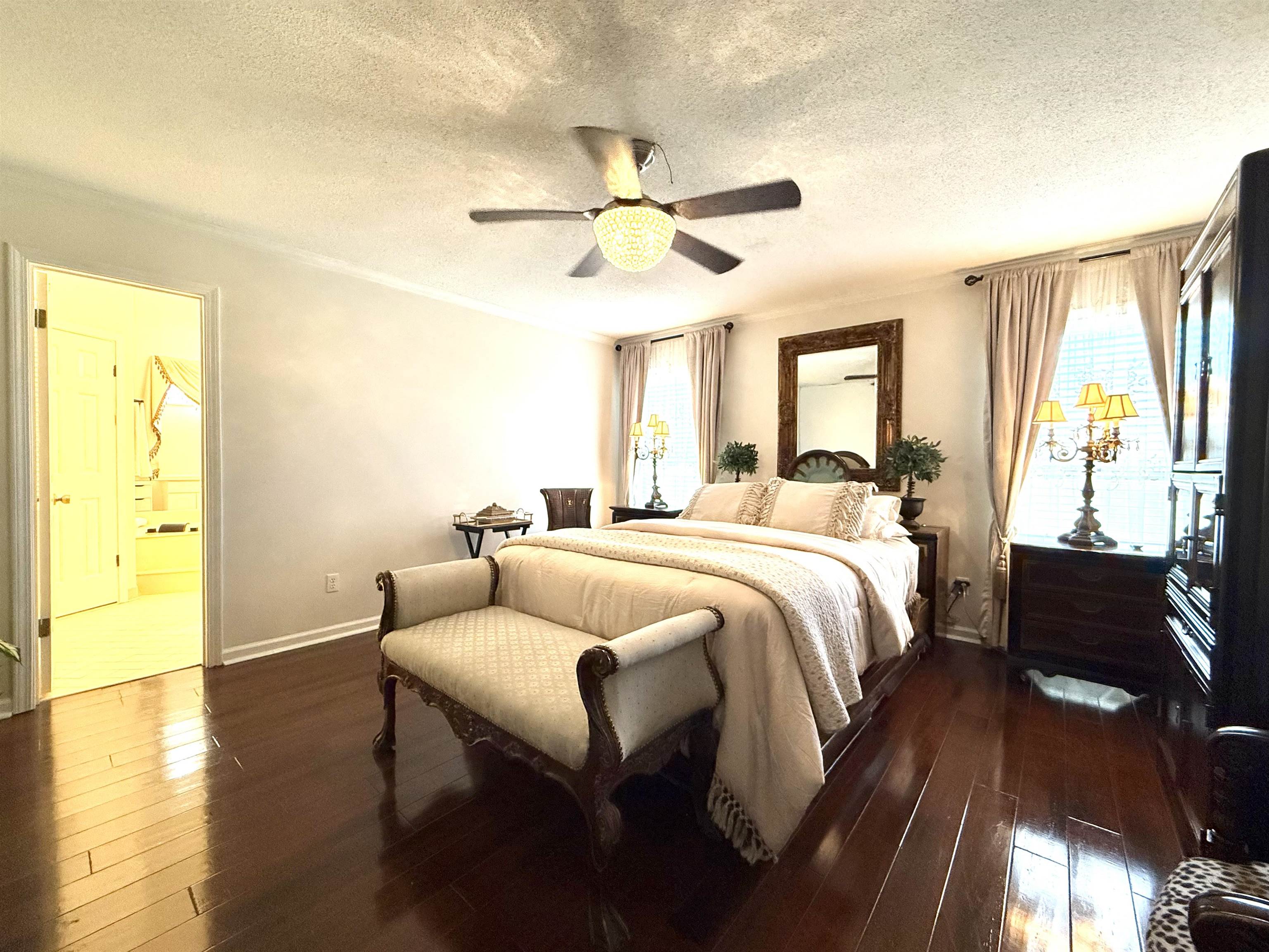 825 North Walnut Bend Road Memphis, TN 38018 - Photo 19 of 40 a bedroom with a bed and wooden floor