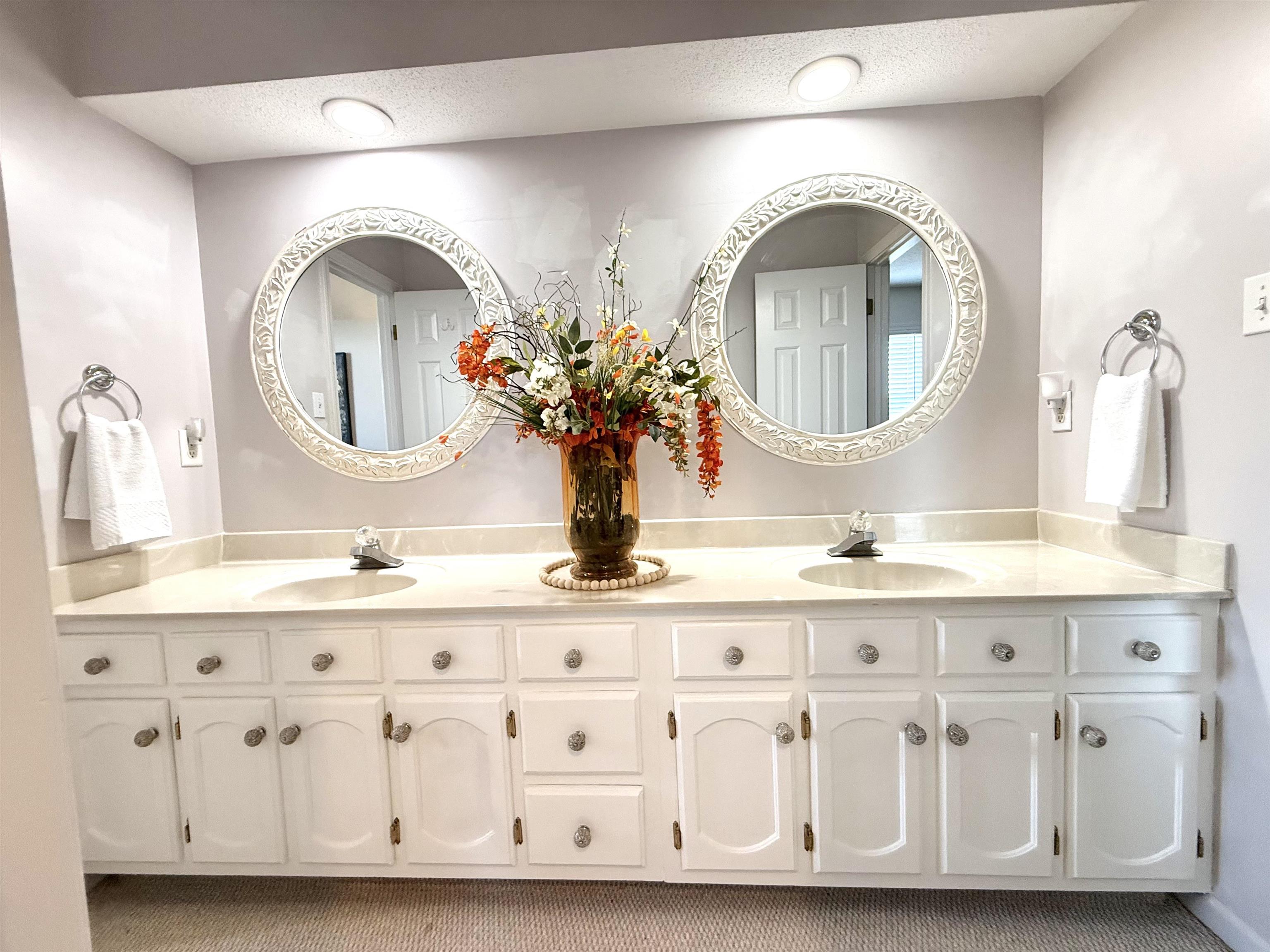 825 North Walnut Bend Road Memphis, TN 38018 - Photo 30 of 40 a bathroom with a granite countertop double vanity sink and a mirror