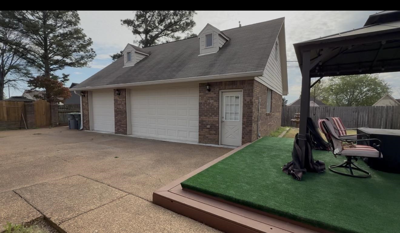 825 North Walnut Bend Road Memphis, TN 38018 - Photo 38 of 40 a front view of a house with a yard