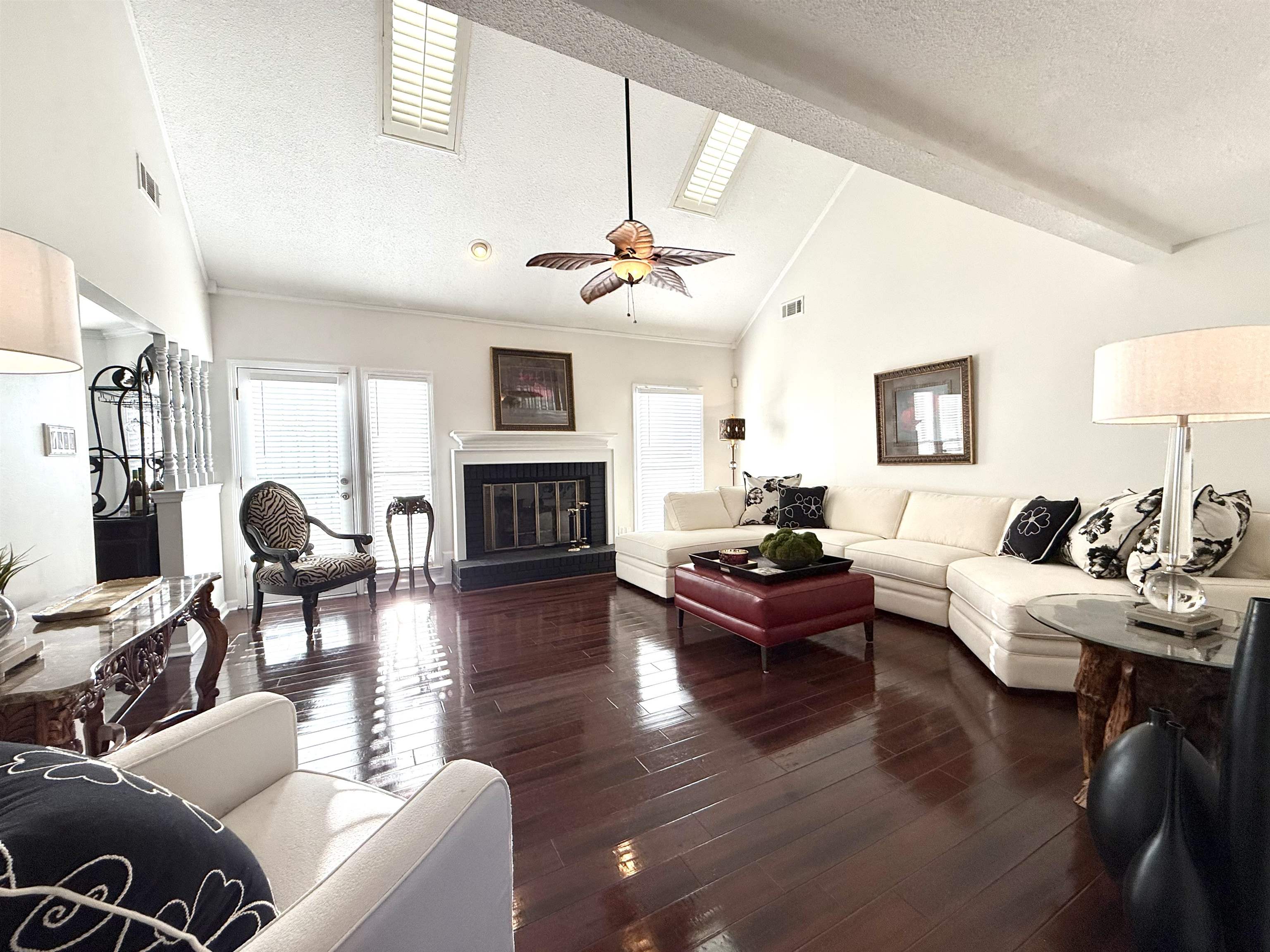 825 North Walnut Bend Road Memphis, TN 38018 - Photo 7 of 40 a living room with furniture a fireplace and a chandelier