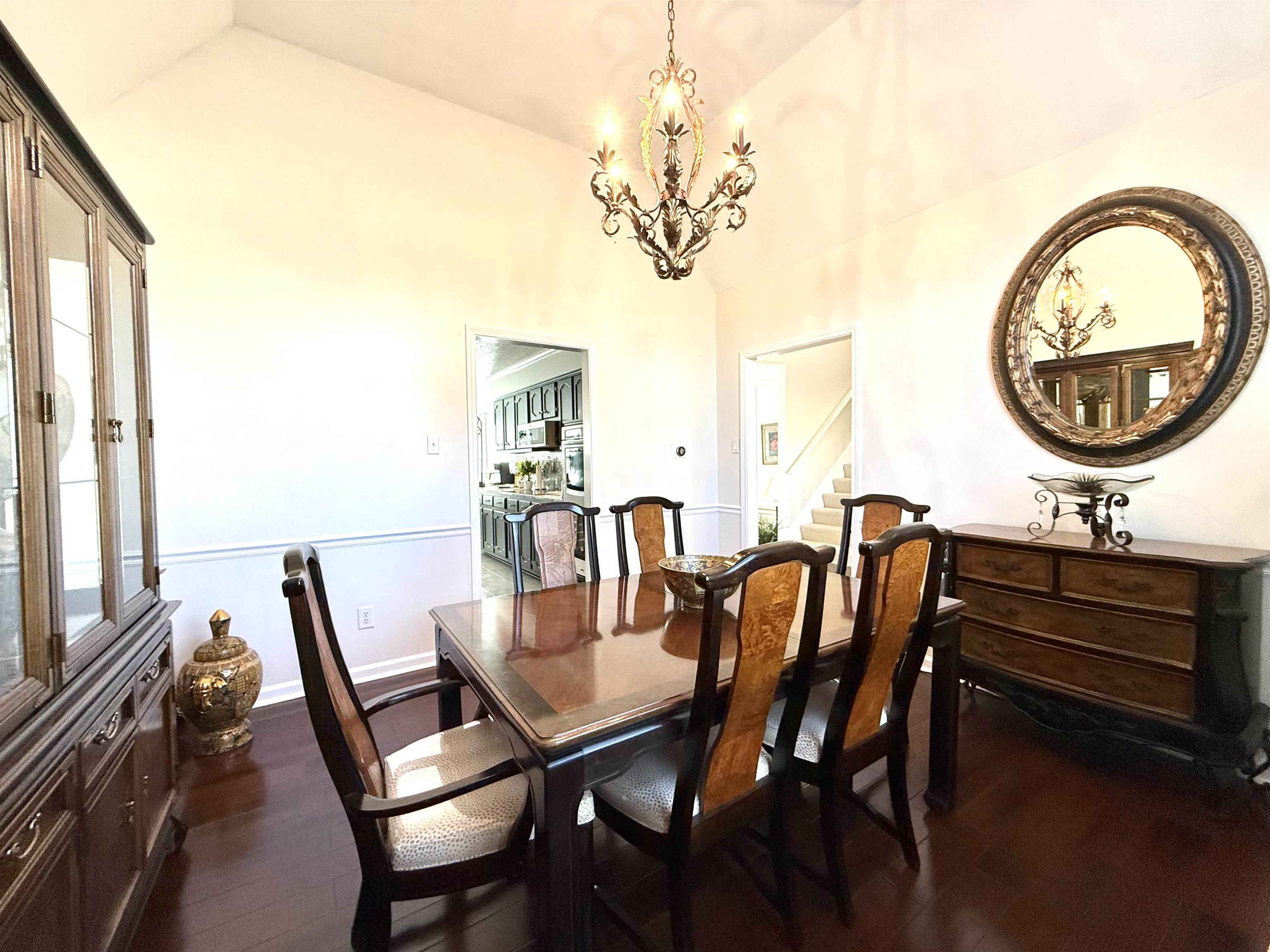 825 North Walnut Bend Road Memphis, TN 38018 - Photo 9 of 40 a view of a dining room with furniture and a chandelier