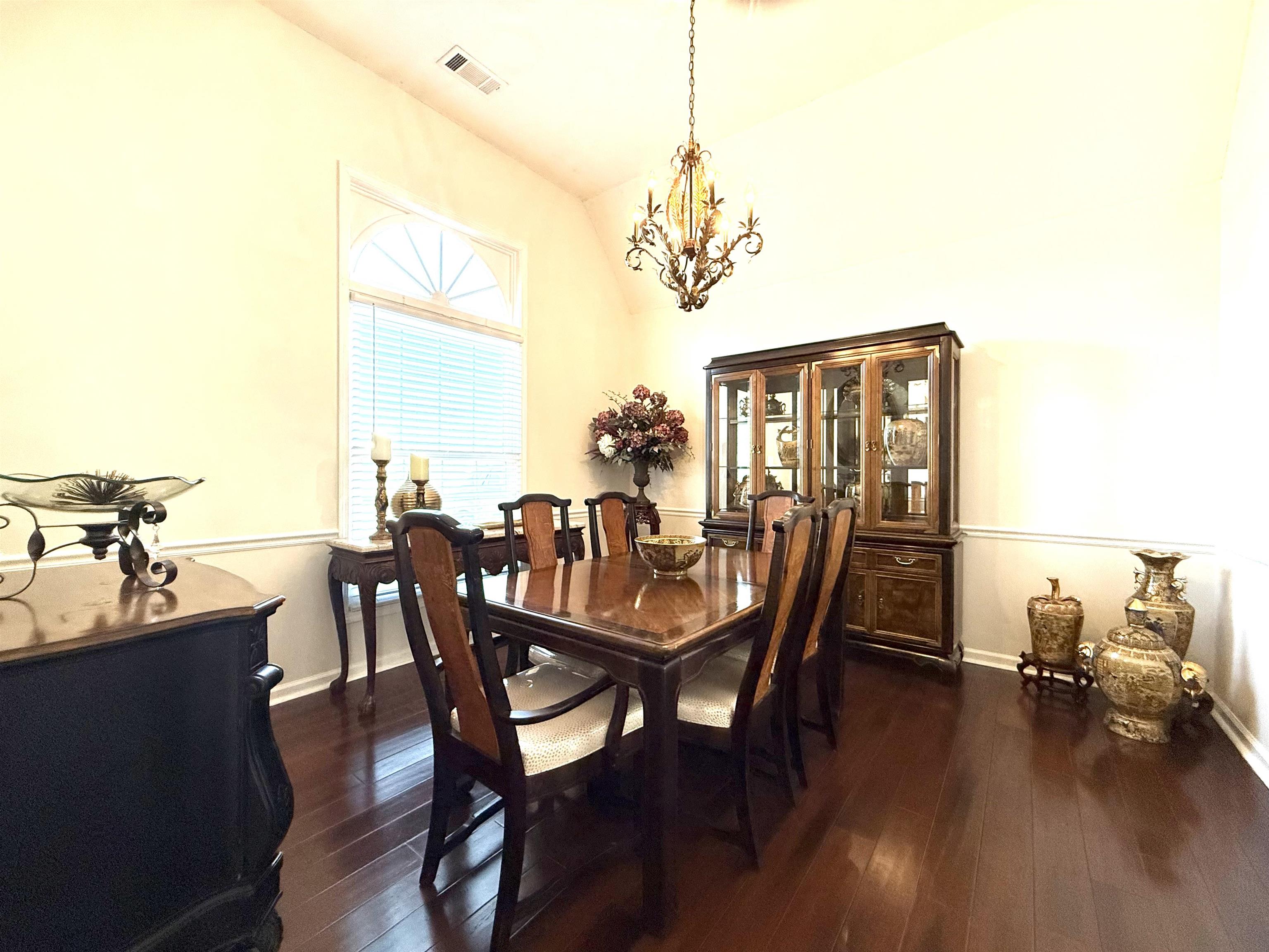 825 North Walnut Bend Road Memphis, TN 38018 - Photo 10 of 40 a view of a dining room with furniture window and wooden floor