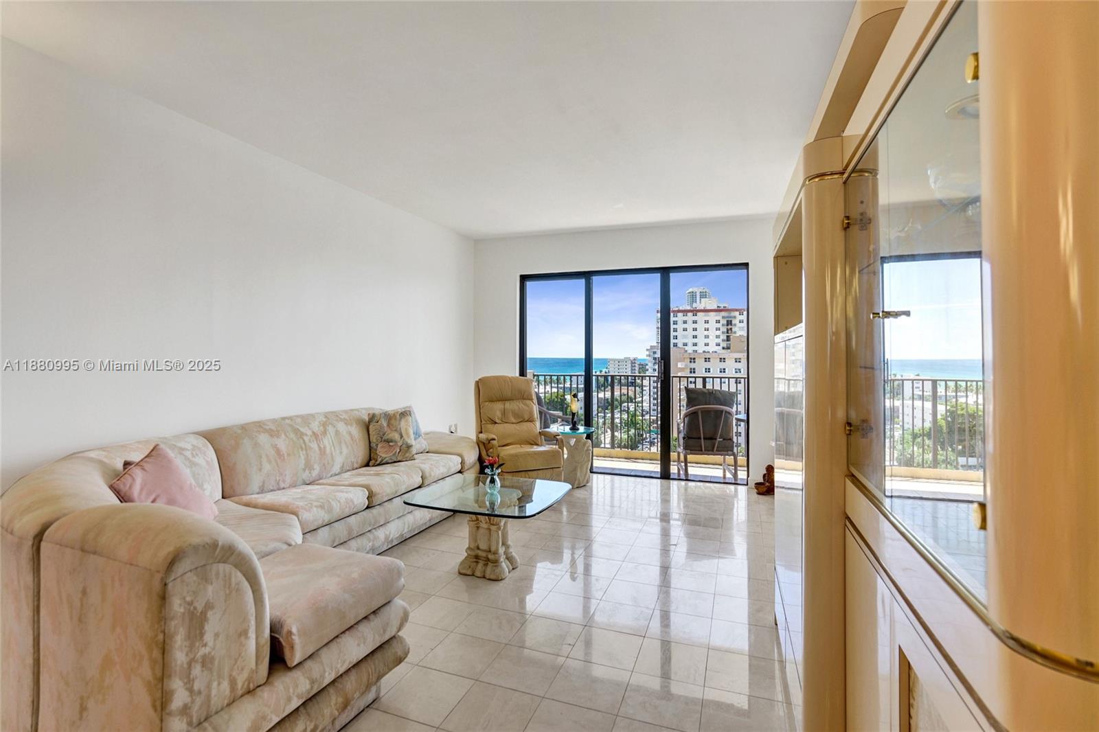 1201 South Ocean Drive, Unit 1010S Hollywood, FL 33019 - Photo 12 of 41 a living room with furniture and a floor to ceiling window