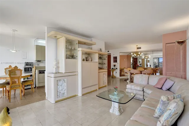 a kitchen with stainless steel appliances a stove a table and chairs