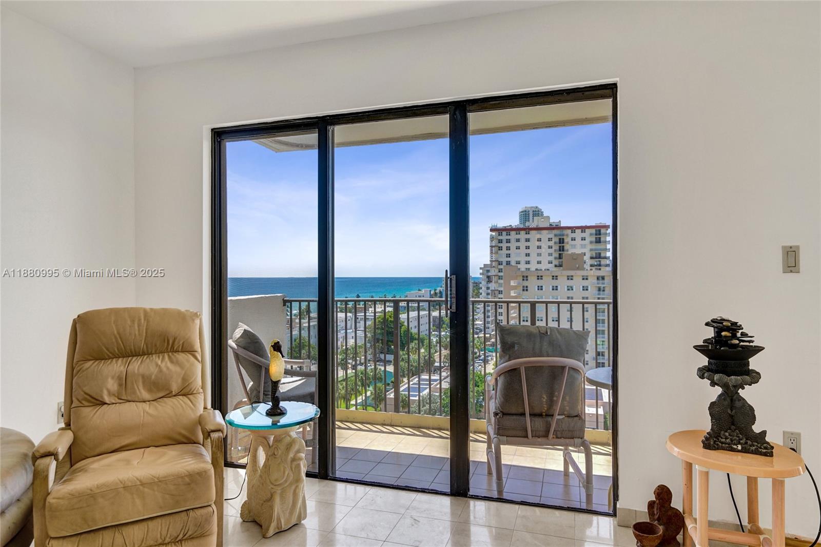 1201 South Ocean Drive, Unit 1010S Hollywood, FL 33019 - Photo 15 of 41 a living room with furniture and a floor to ceiling window