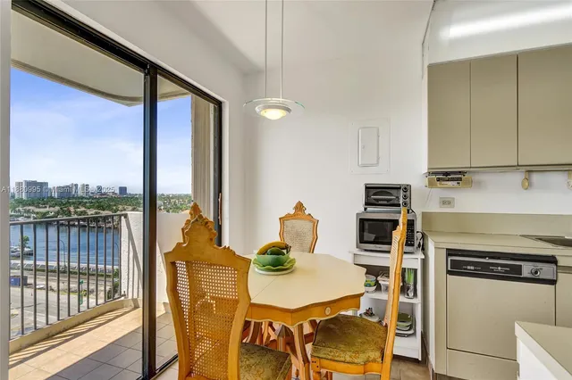 a kitchen with a stove a sink and a refrigerator