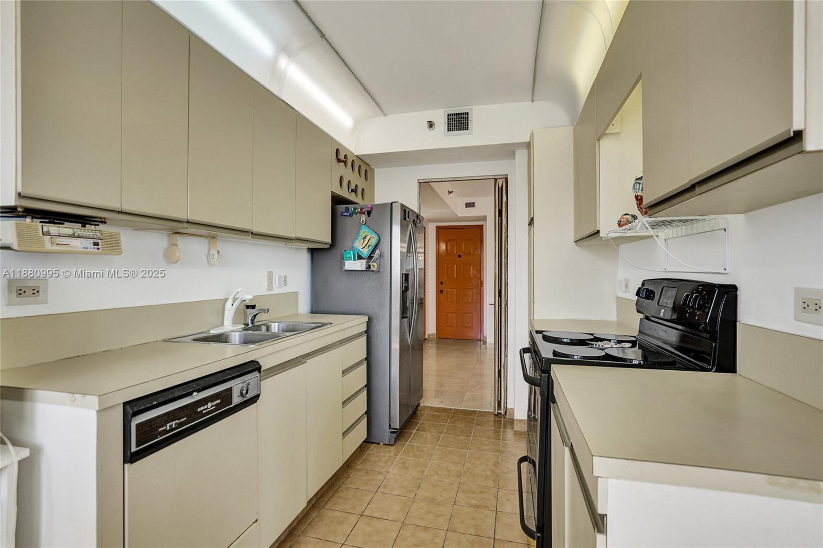 1201 South Ocean Drive, Unit 1010S Hollywood, FL 33019 - Photo 17 of 41 a kitchen that has a sink and a stove