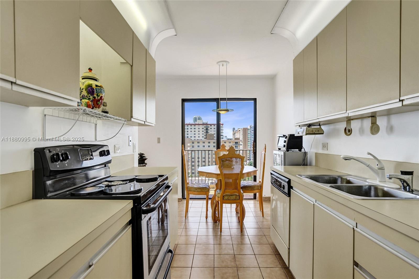1201 South Ocean Drive, Unit 1010S Hollywood, FL 33019 - Photo 18 of 41 a kitchen with a stove a sink and a refrigerator