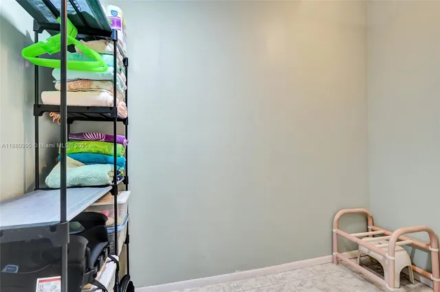 a bedroom with a bed and a television