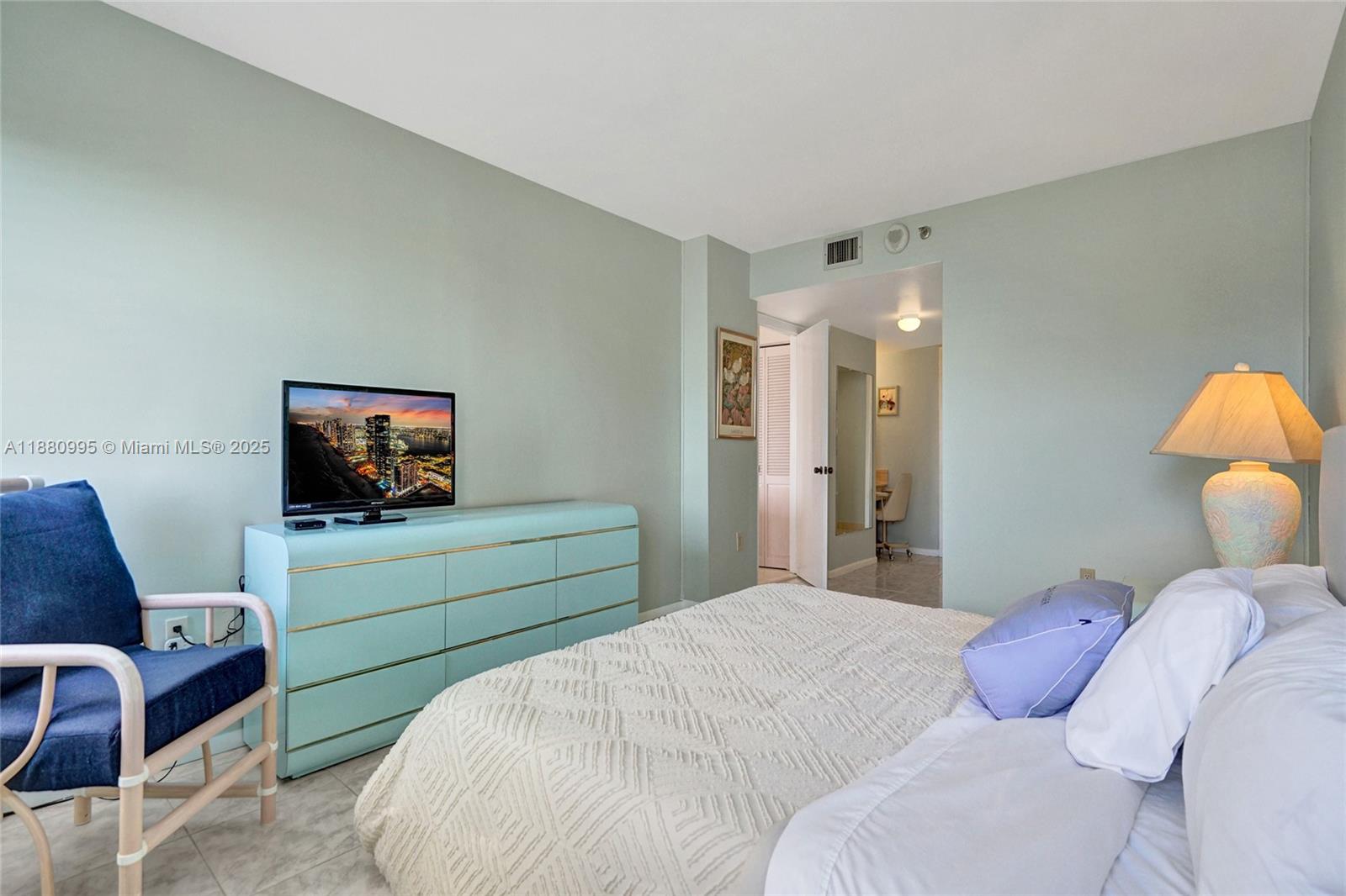 1201 South Ocean Drive, Unit 1010S Hollywood, FL 33019 - Photo 23 of 41 a bedroom with a bed and a television