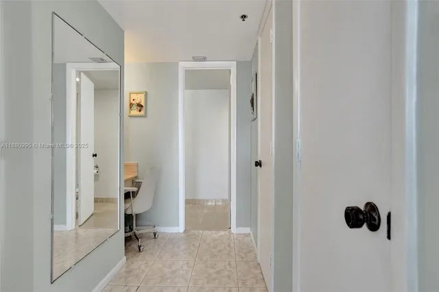 a room with a sink and a mirror