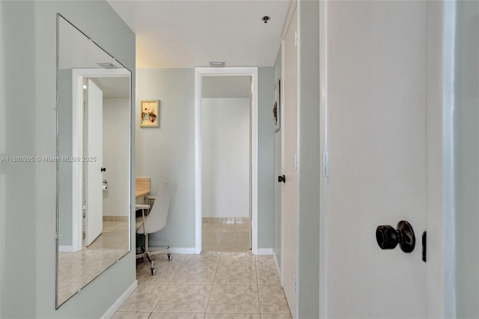 1201 South Ocean Drive, Unit 1010S Hollywood, FL 33019 - Photo 24 of 41 a view of a bathroom with a sink and a mirror