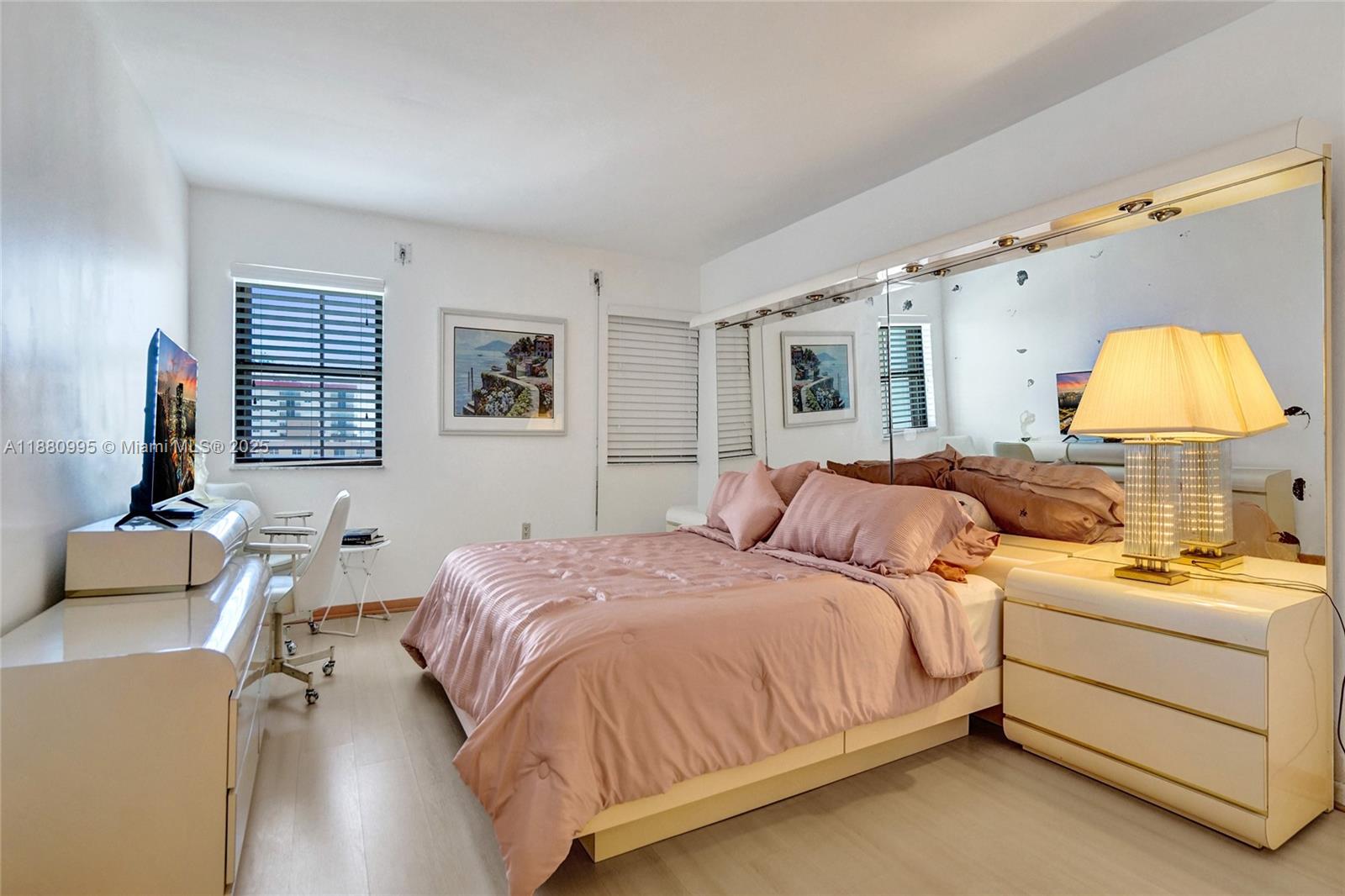 1201 South Ocean Drive, Unit 1010S Hollywood, FL 33019 - Photo 28 of 41 a bedroom with a bed and a lamp