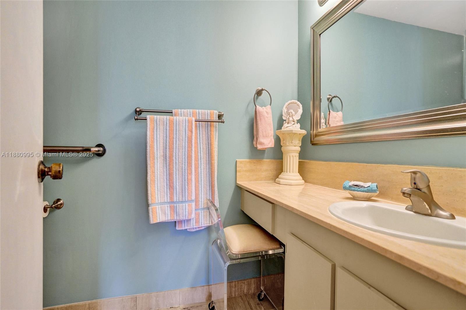 1201 South Ocean Drive, Unit 1010S Hollywood, FL 33019 - Photo 30 of 41 a bathroom with a sink and a mirror