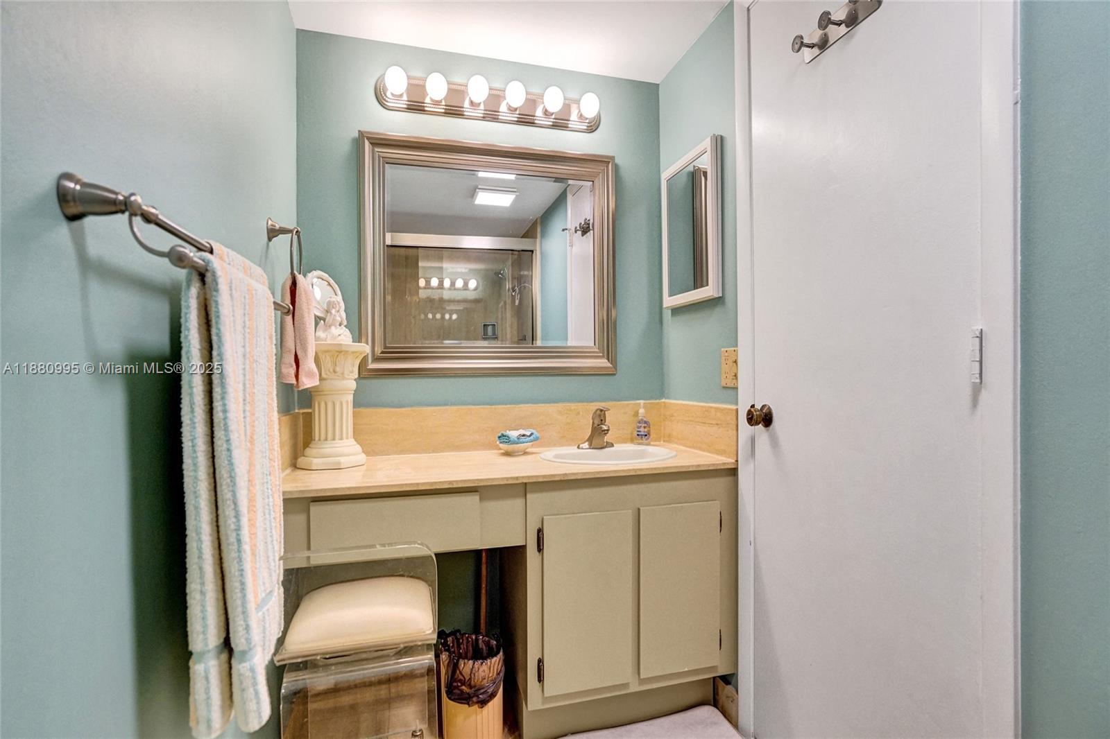 1201 South Ocean Drive, Unit 1010S Hollywood, FL 33019 - Photo 31 of 41 a bathroom with a sink and a mirror