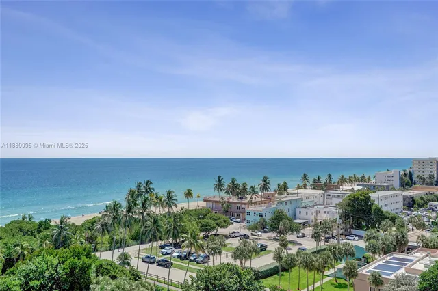 a view of a balcony with wooden floor and fence