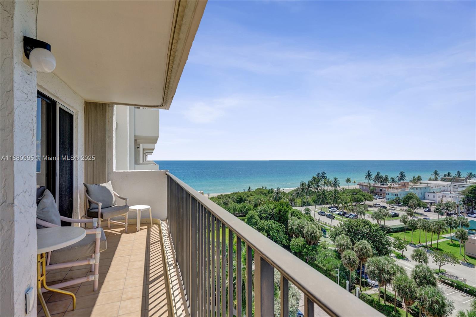 1201 South Ocean Drive, Unit 1010S Hollywood, FL 33019 - Photo 39 of 41 a view of a balcony with wooden floor and fence