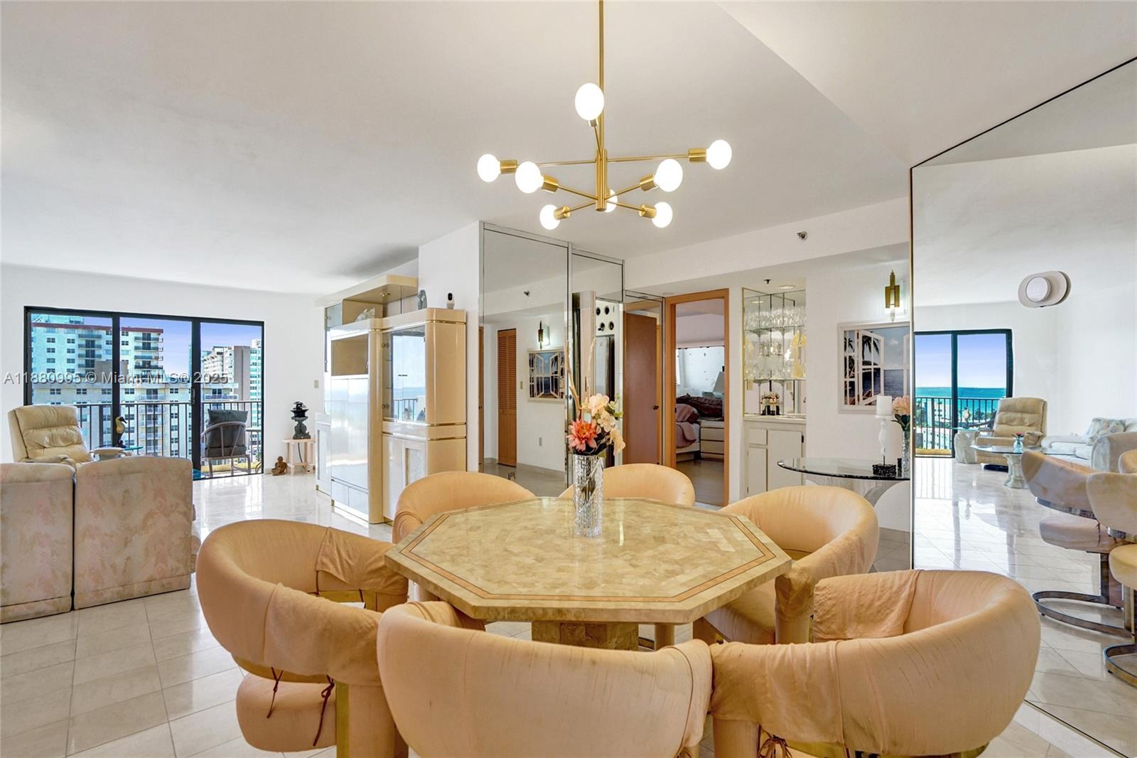 1201 South Ocean Drive, Unit 1010S Hollywood, FL 33019 - Photo 4 of 41 a living room with fireplace furniture and a chandelier