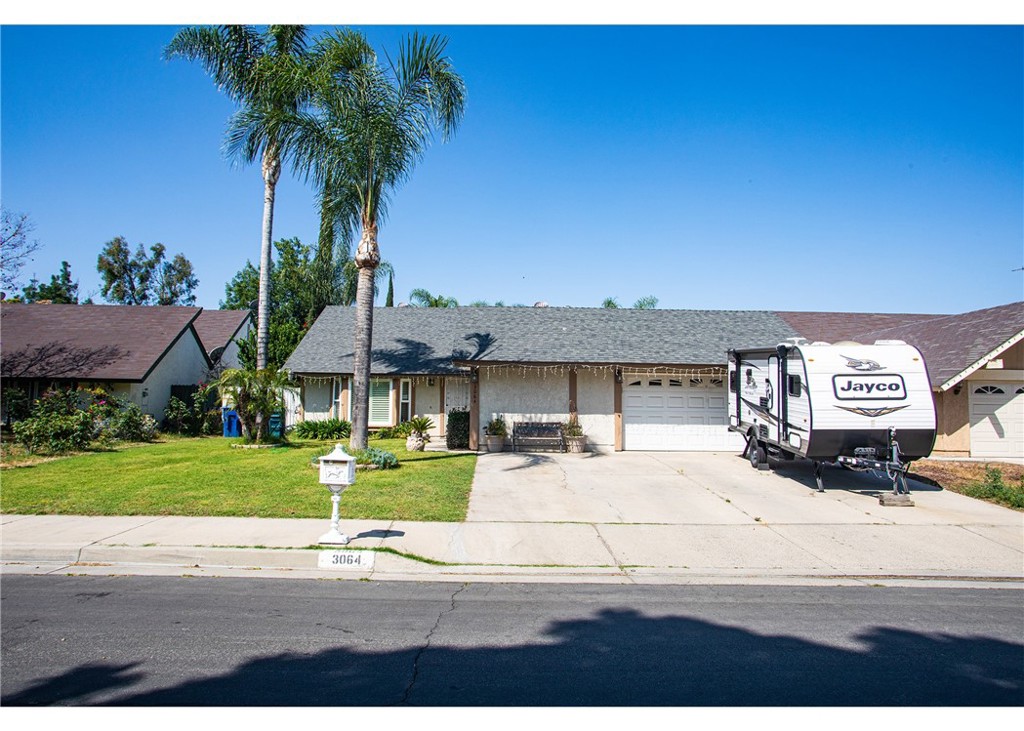 3064 Hoya Place Riverside, CA 92503 - Photo 1 of 1 a front view of a house with a yard and garage