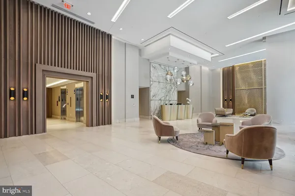 a very nice looking room with a large window and chandelier