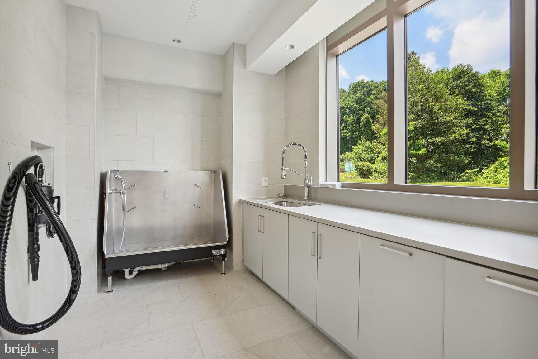 7887 Jones Branch Drive, Unit 803 McLean, VA 22102 - Photo 24 of 35 a bathroom with a sink and a mirror