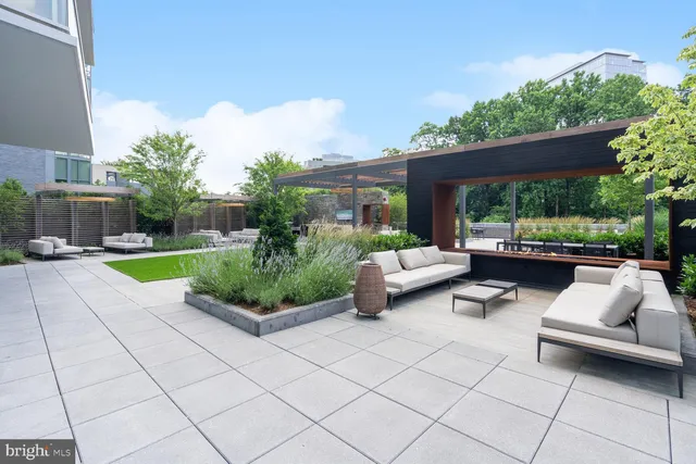 a view of a patio with couches and a table and chairs
