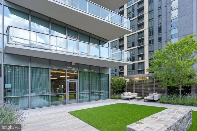 a view of a building with a garden and plants