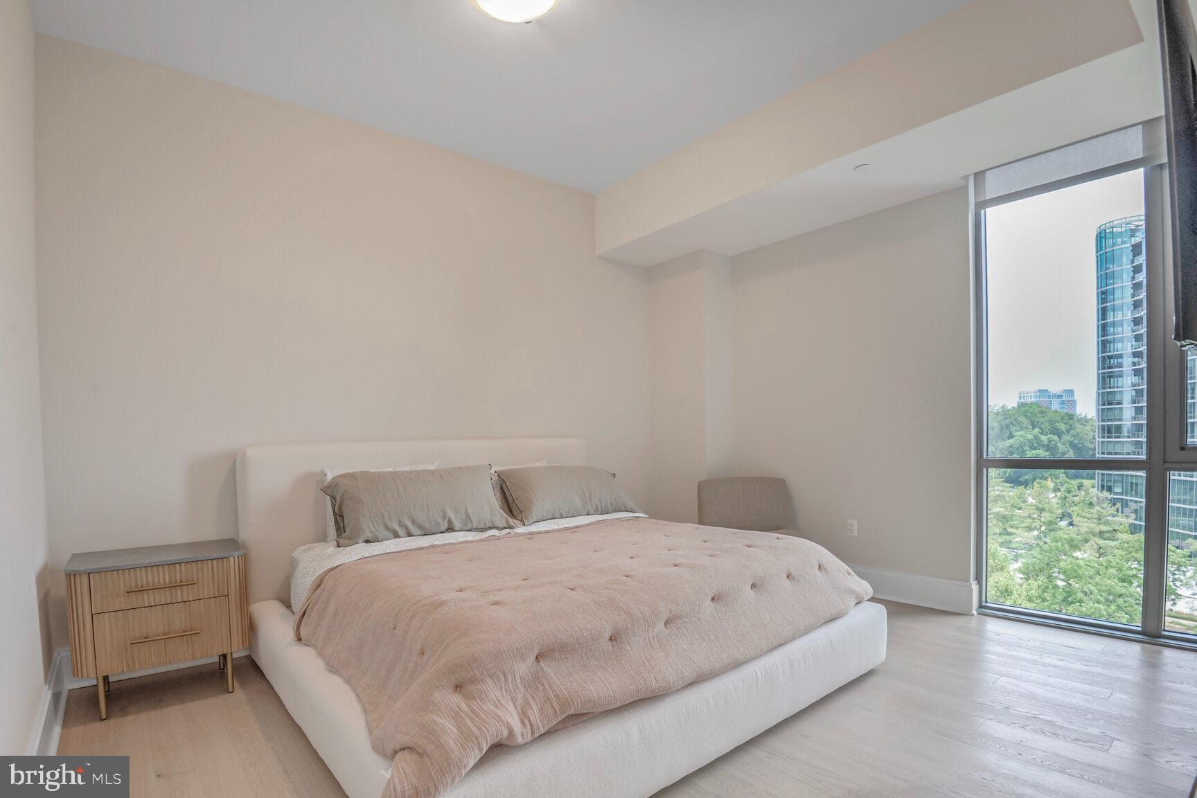 7887 Jones Branch Drive, Unit 803 McLean, VA 22102 - Photo 5 of 35 a bedroom with a bed and a window