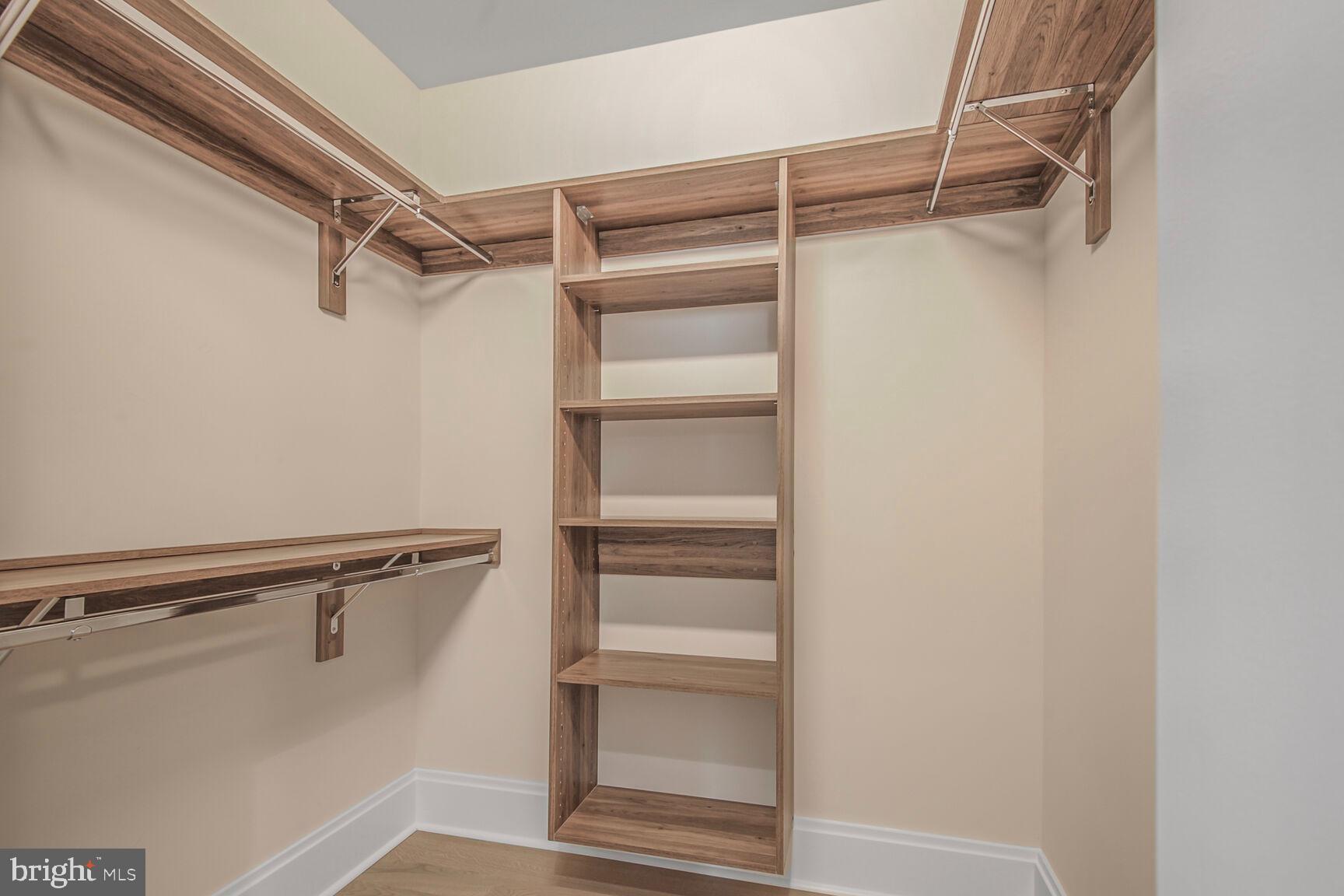7887 Jones Branch Drive, Unit 803 McLean, VA 22102 - Photo 7 of 35 a view of walk in closet with empty racks