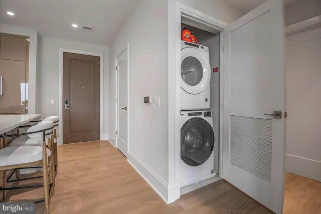 a bathroom with a shower sink vanity and mirror