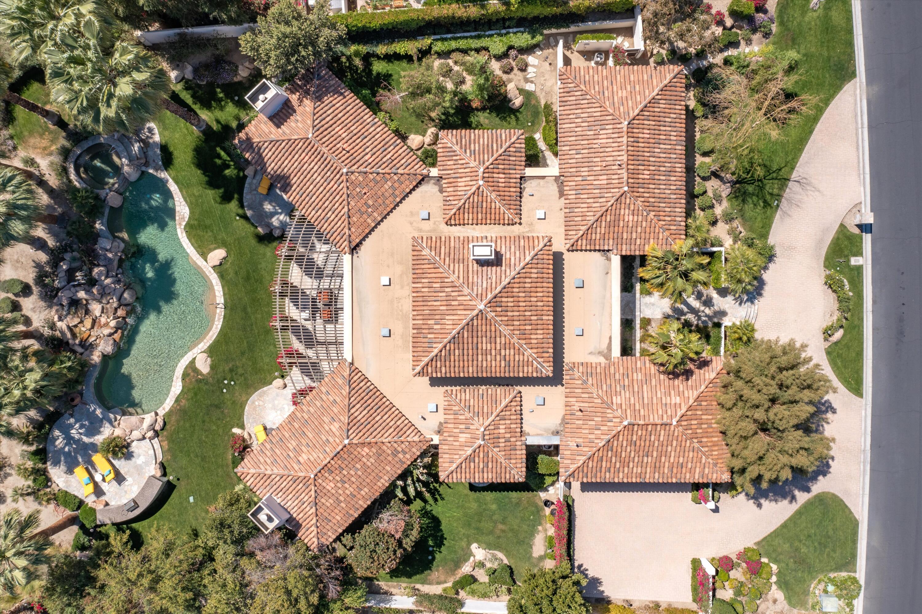 78411 Talking Rock Turn La Quinta, CA 92253 - Photo 12 of 70 an aerial view of a house with a yard and a large tree