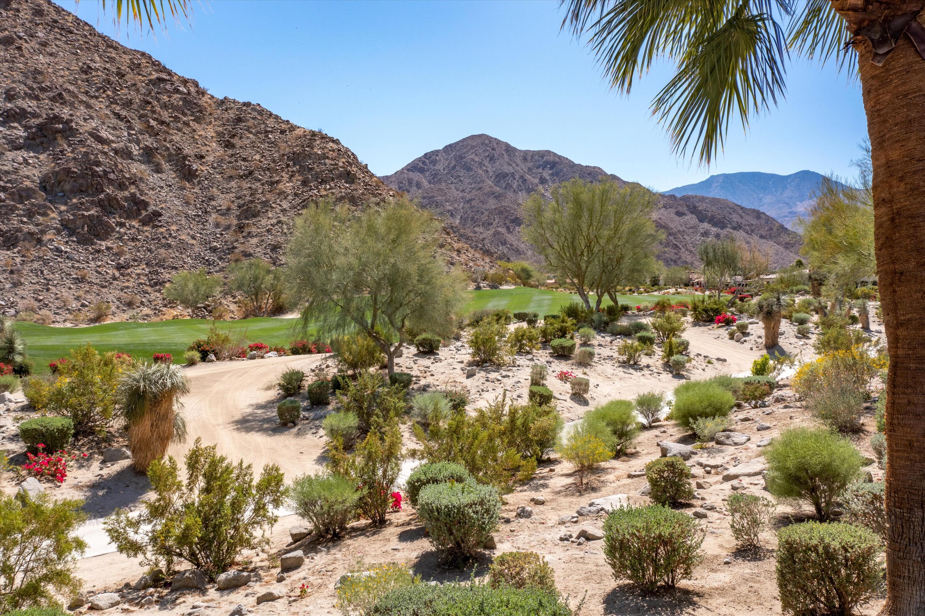 78411 Talking Rock Turn La Quinta, CA 92253 - Photo 19 of 70 a view of a lake with a mountain in the background