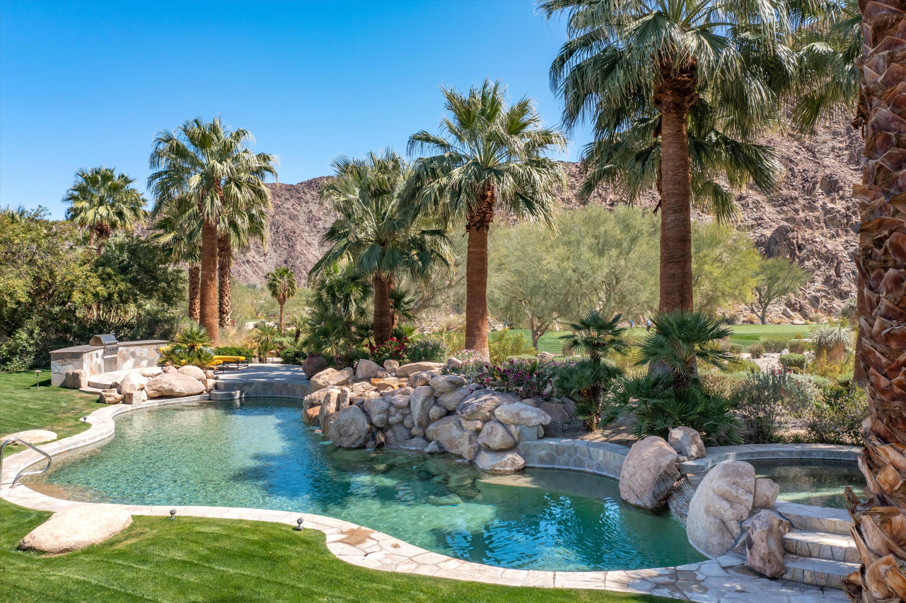78411 Talking Rock Turn La Quinta, CA 92253 - Photo 21 of 70 a view of swimming pool with a yard and outdoor seating