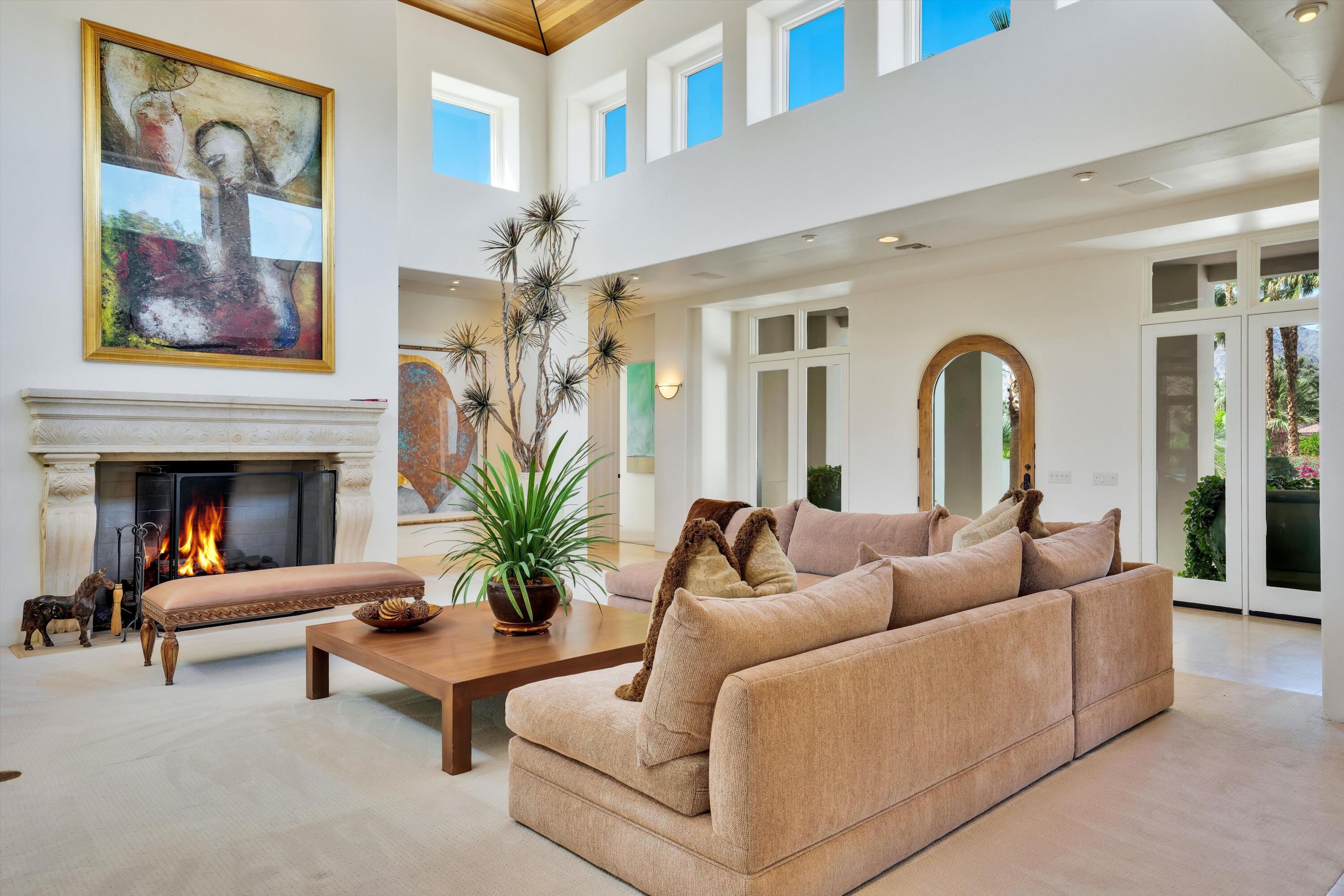 78411 Talking Rock Turn La Quinta, CA 92253 - Photo 33 of 70 a living room with furniture potted plant and a fireplace