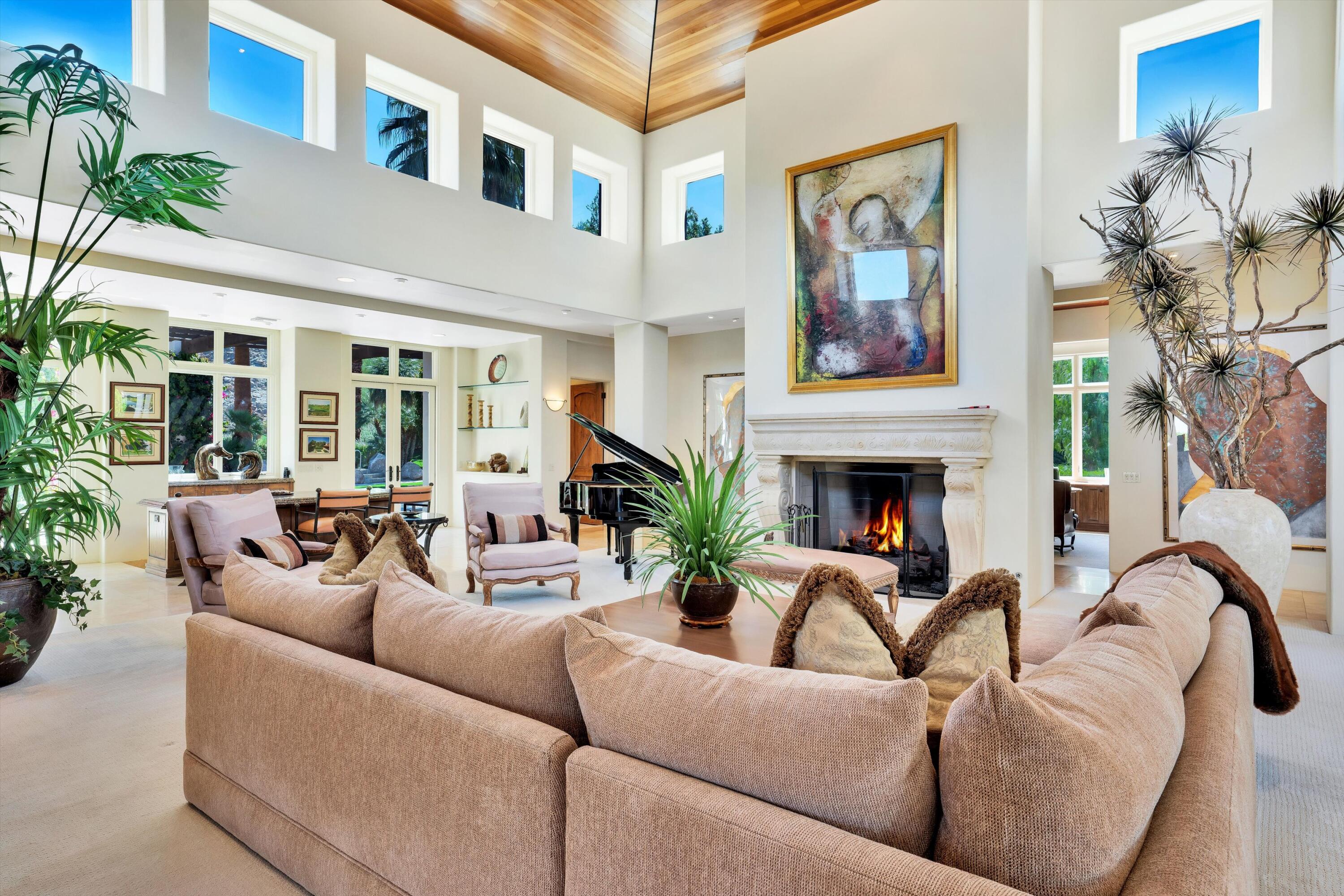 78411 Talking Rock Turn La Quinta, CA 92253 - Photo 35 of 70 a living room with furniture flower pot and a fireplace