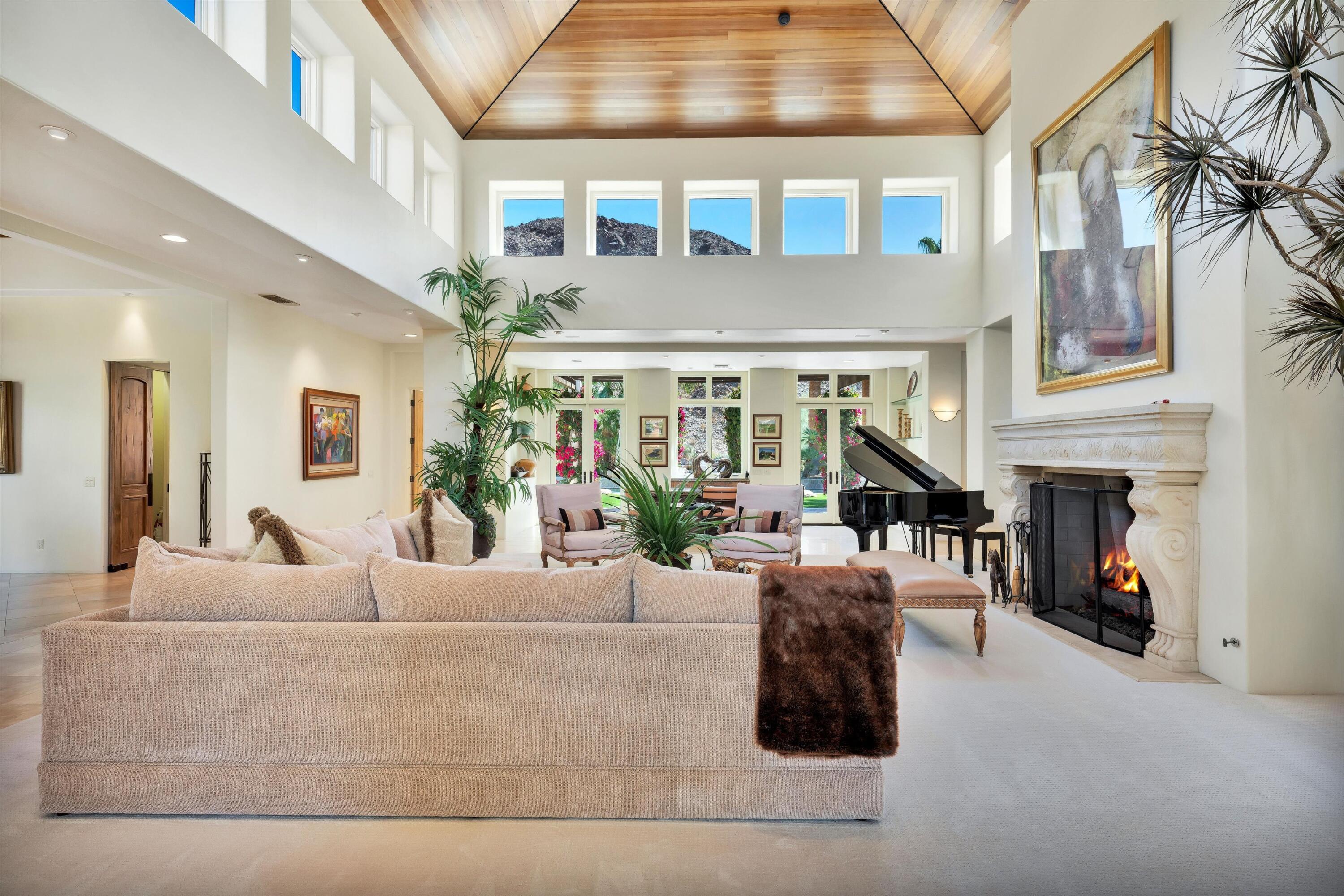 78411 Talking Rock Turn La Quinta, CA 92253 - Photo 36 of 70 a living room with furniture and a fireplace