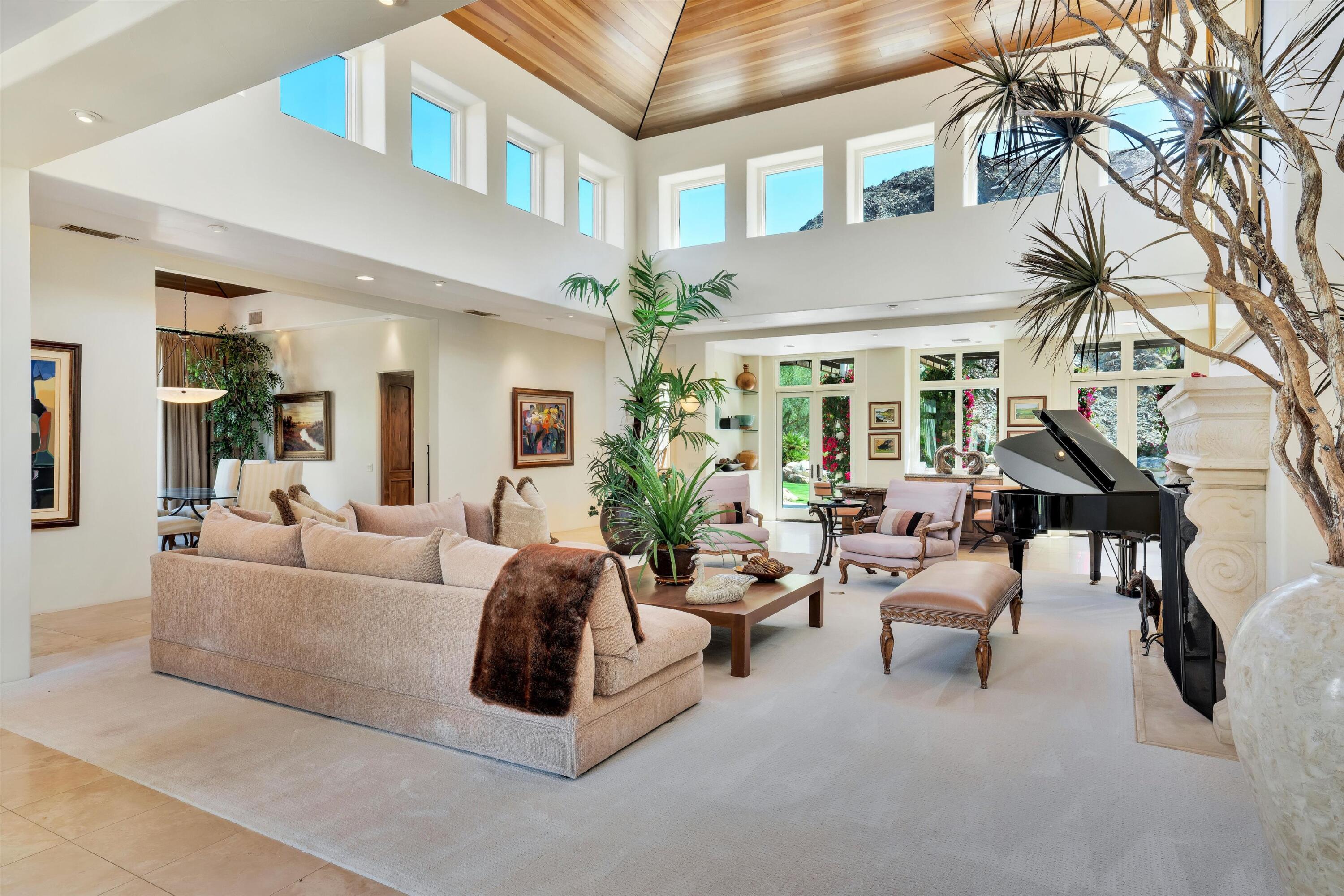 78411 Talking Rock Turn La Quinta, CA 92253 - Photo 37 of 70 a living room with furniture and a chandelier