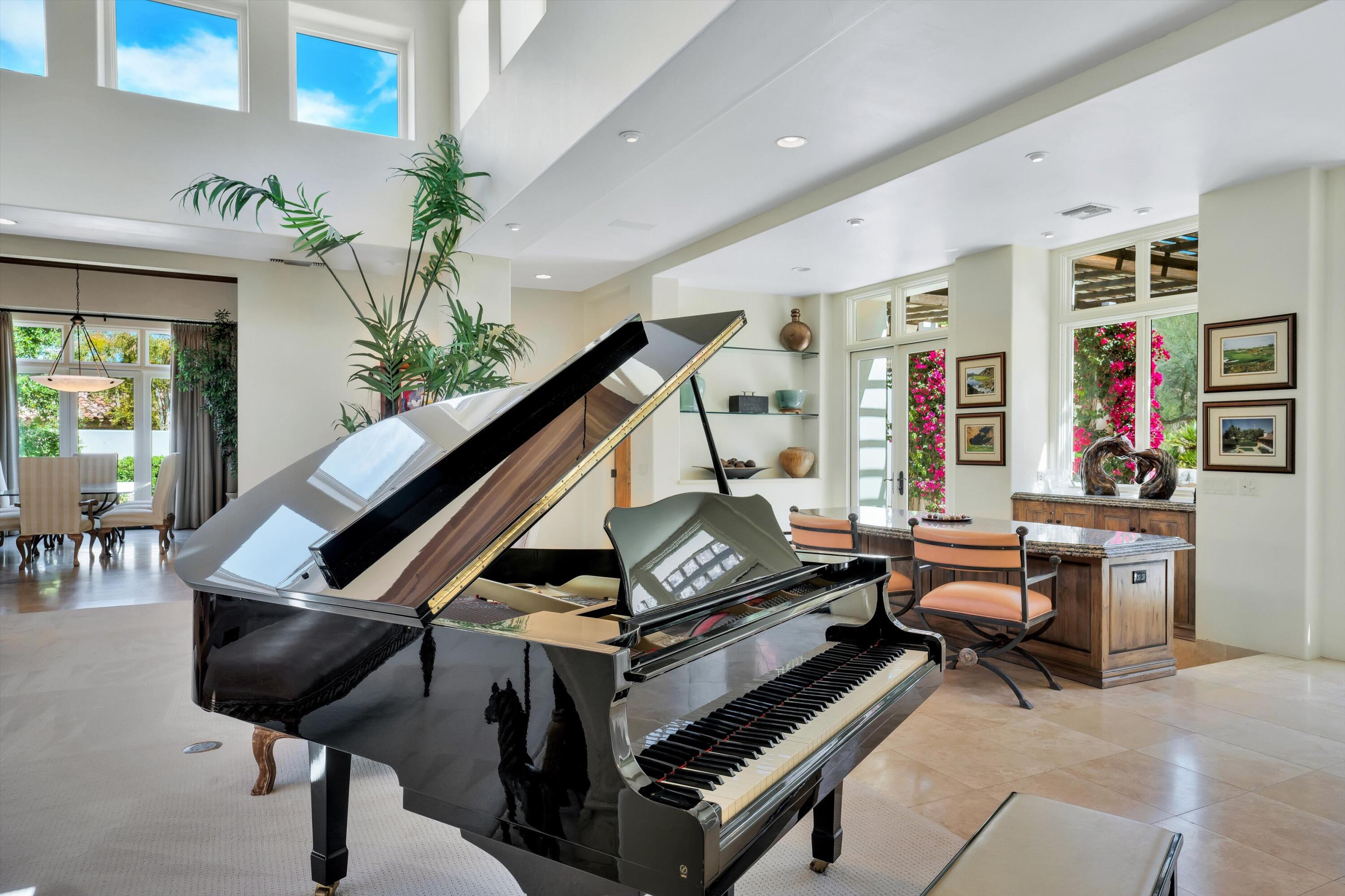 78411 Talking Rock Turn La Quinta, CA 92253 - Photo 53 of 70 a living room with furniture a piano and a potted plant