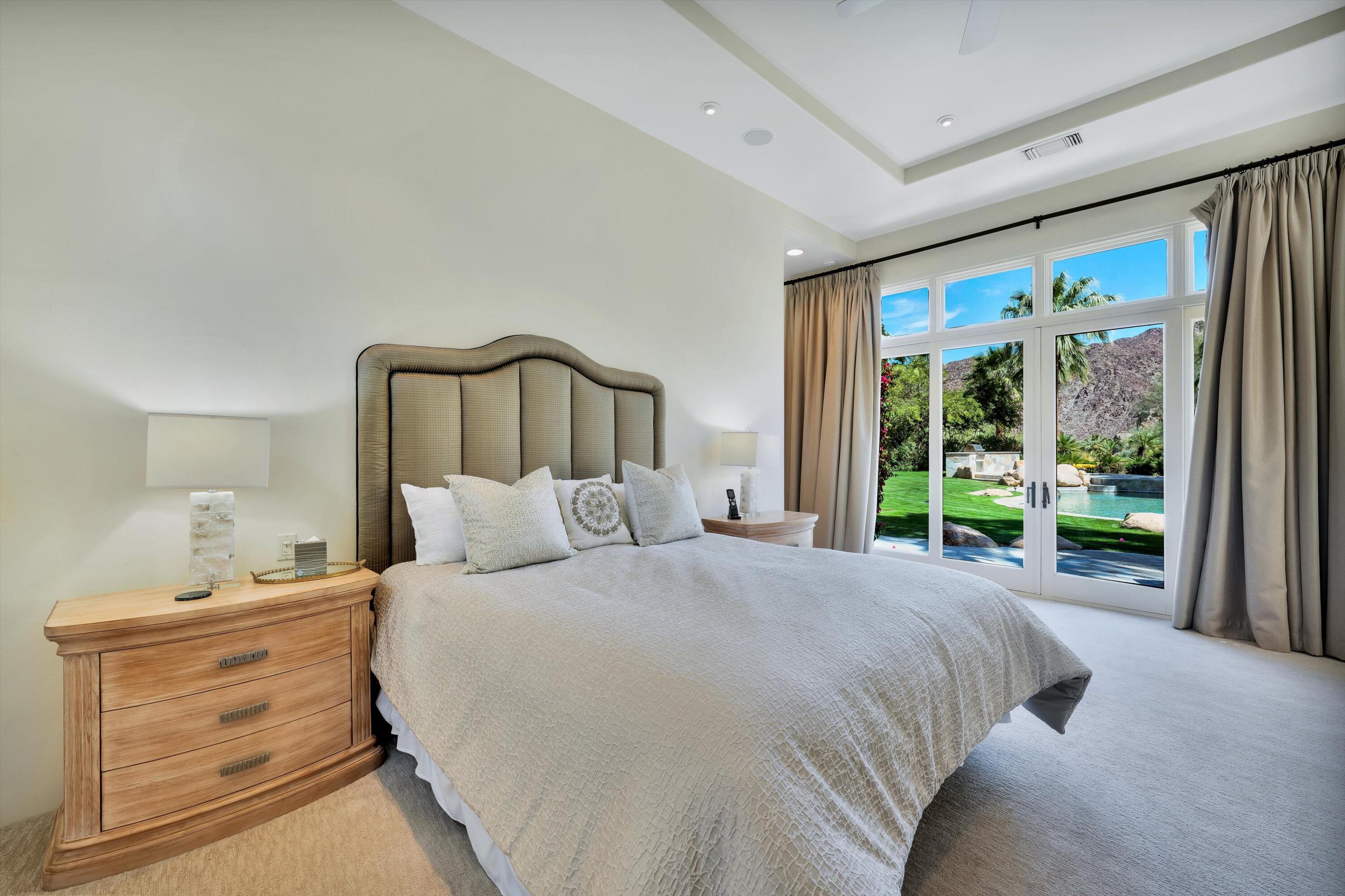 78411 Talking Rock Turn La Quinta, CA 92253 - Photo 56 of 70 a bed room with a bed and a large window