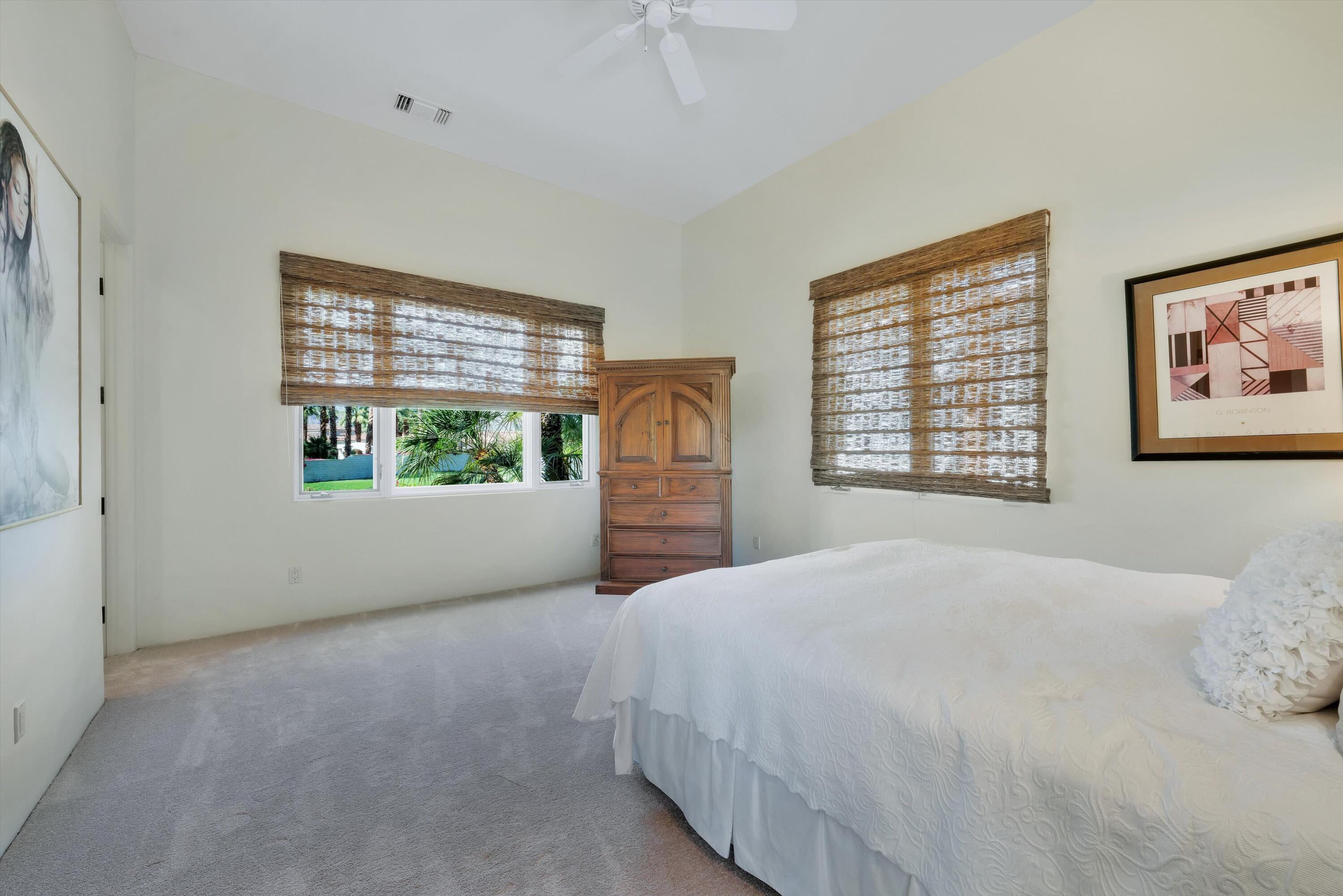 78411 Talking Rock Turn La Quinta, CA 92253 - Photo 59 of 70 a bedroom with a bed and a window