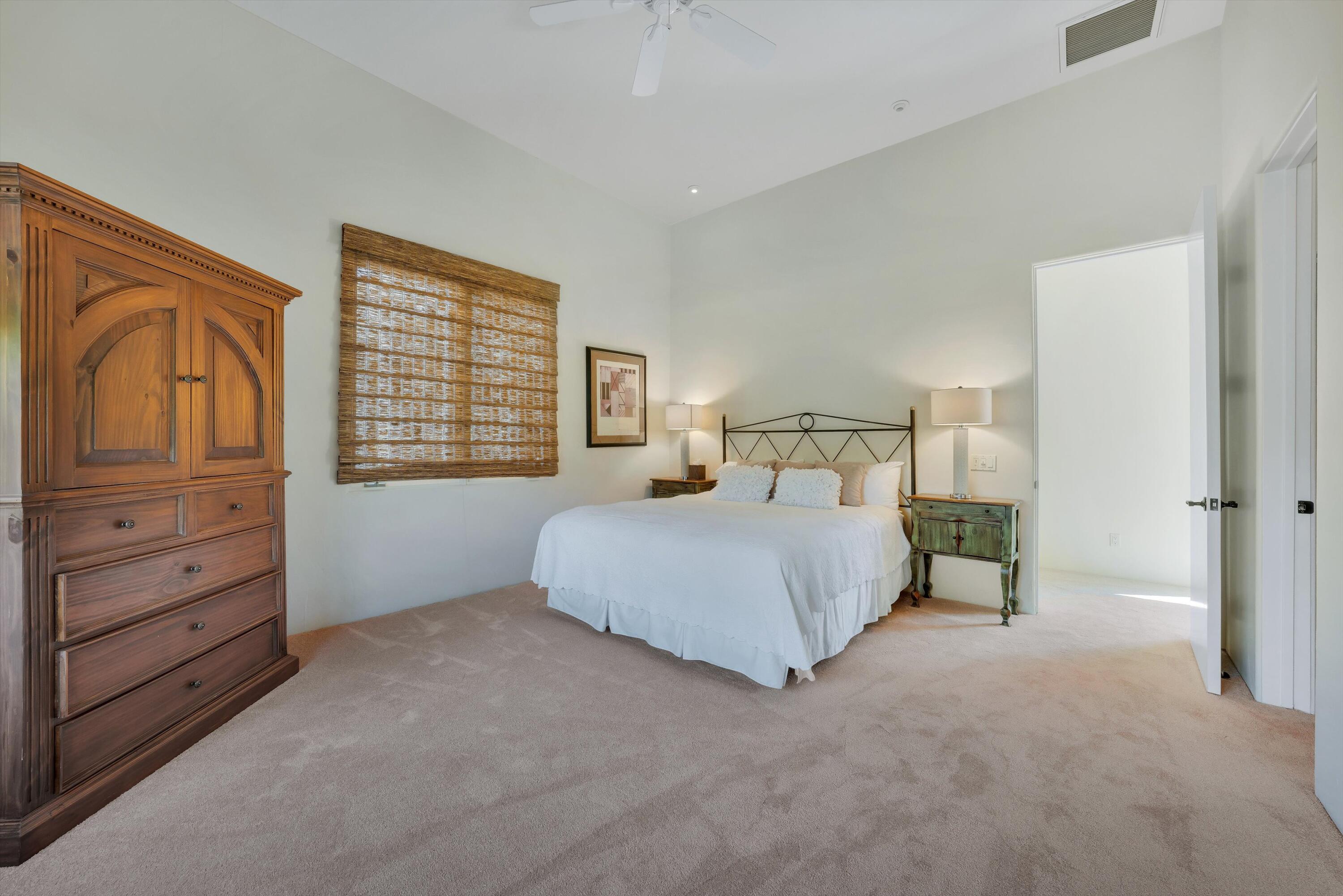 78411 Talking Rock Turn La Quinta, CA 92253 - Photo 60 of 70 a bedroom with a bed and a closet