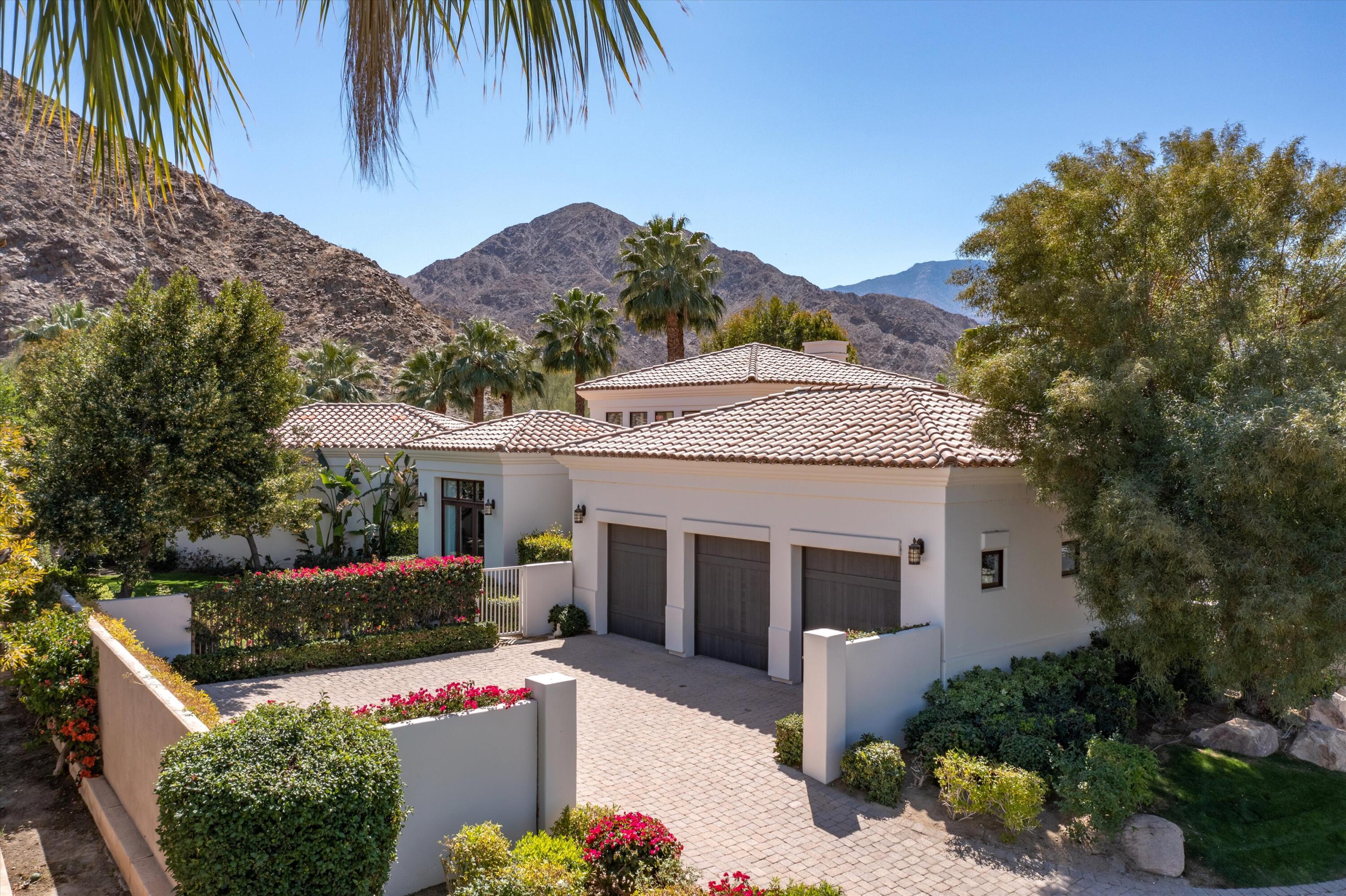 78411 Talking Rock Turn La Quinta, CA 92253 - Photo 6 of 70 a front view of a house with a yard