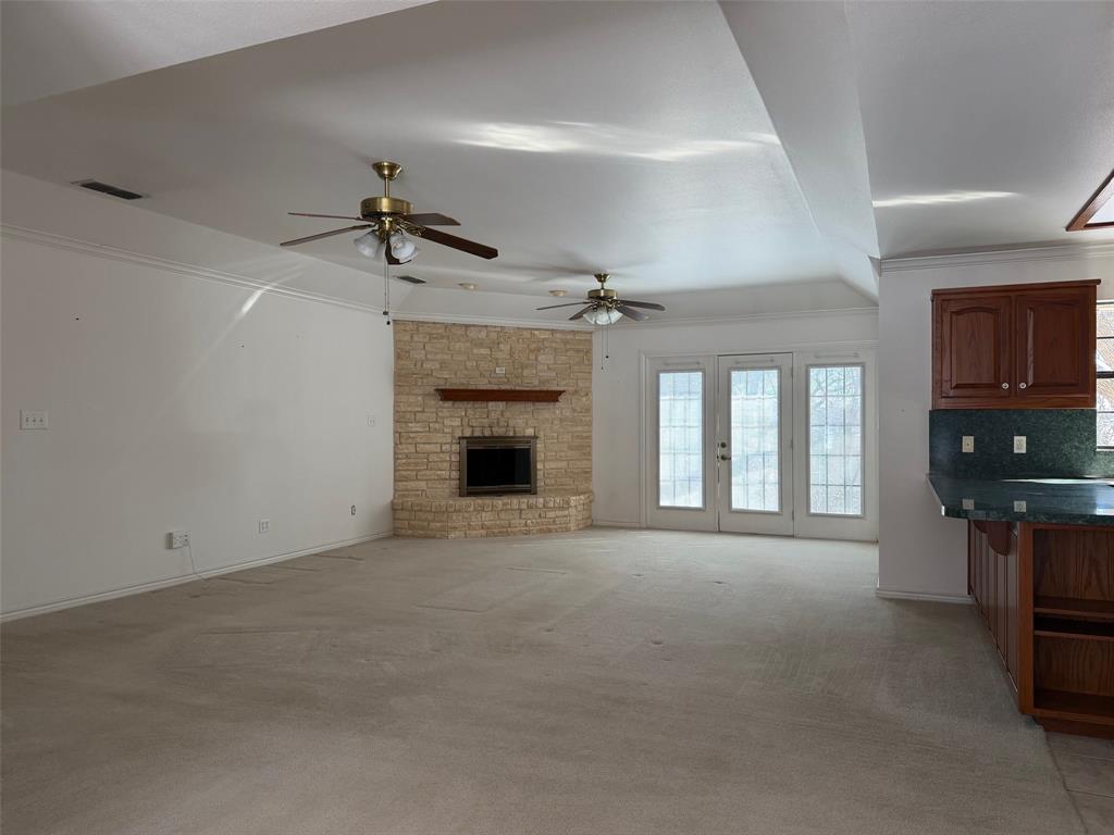 150 Timberidge Lake Road Graham, TX 76450 - Photo 7 of 25 a view of an empty room with a fireplace and a window