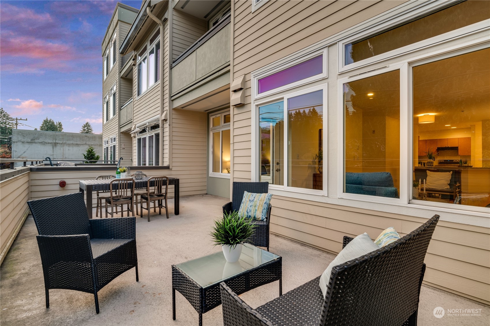 a view of a patio with a table and chairs