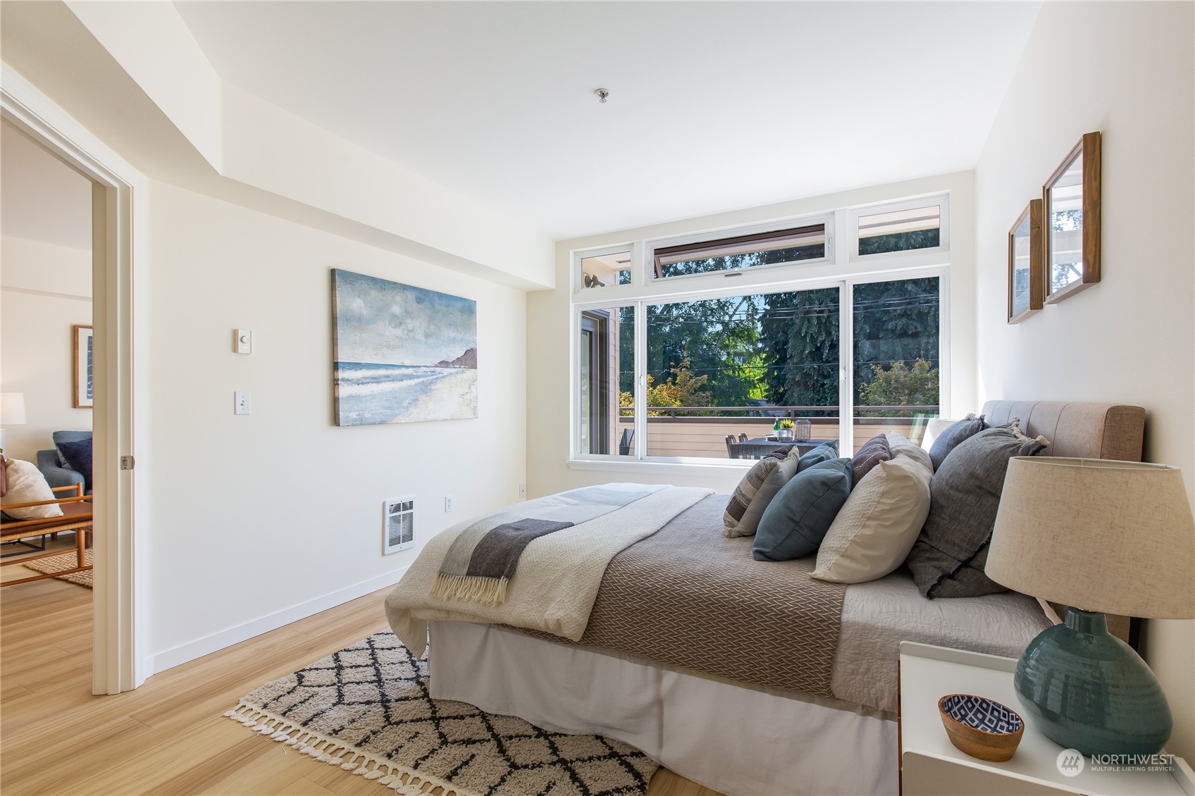 18 Dravus Street, Unit 210 Seattle, WA 98109 - Photo 17 of 38 a bedroom with a bed and wooden floor