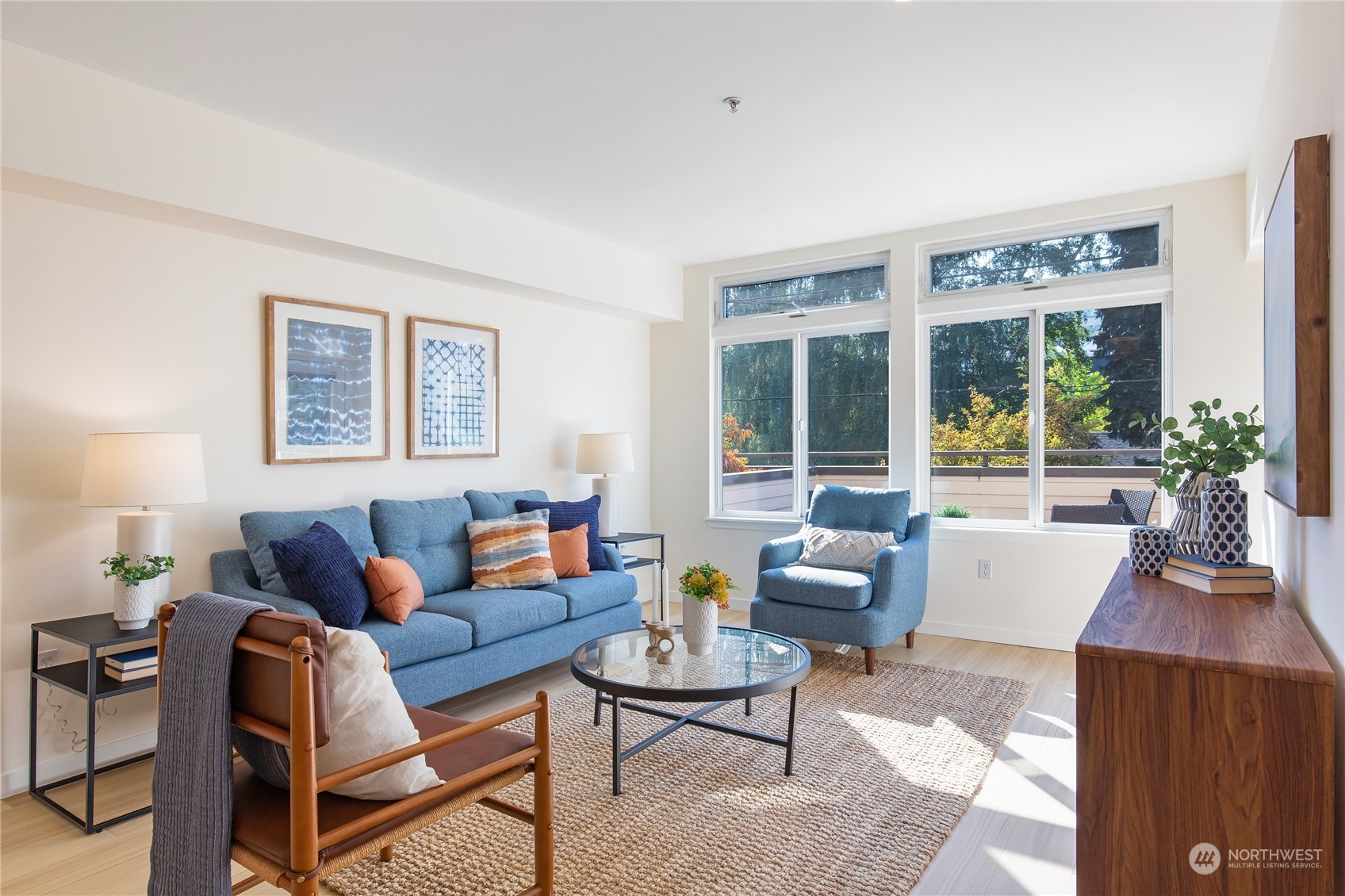 18 Dravus Street, Unit 210 Seattle, WA 98109 - Photo 18 of 38 a living room with furniture and a large window