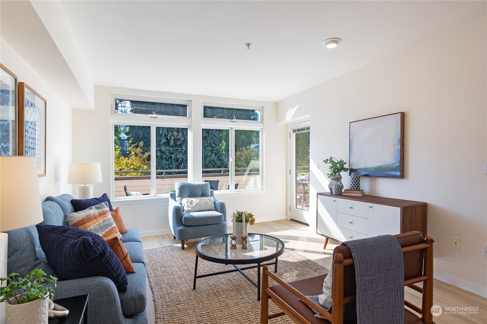 18 Dravus Street, Unit 210 Seattle, WA 98109 - Photo 19 of 38 a living room with furniture and a large window
