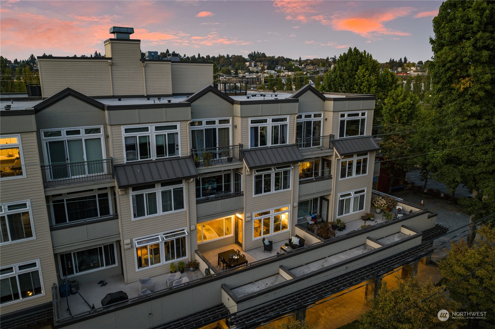 18 Dravus Street, Unit 210 Seattle, WA 98109 - Photo 2 of 38 a front view of a residential apartment building with a yard